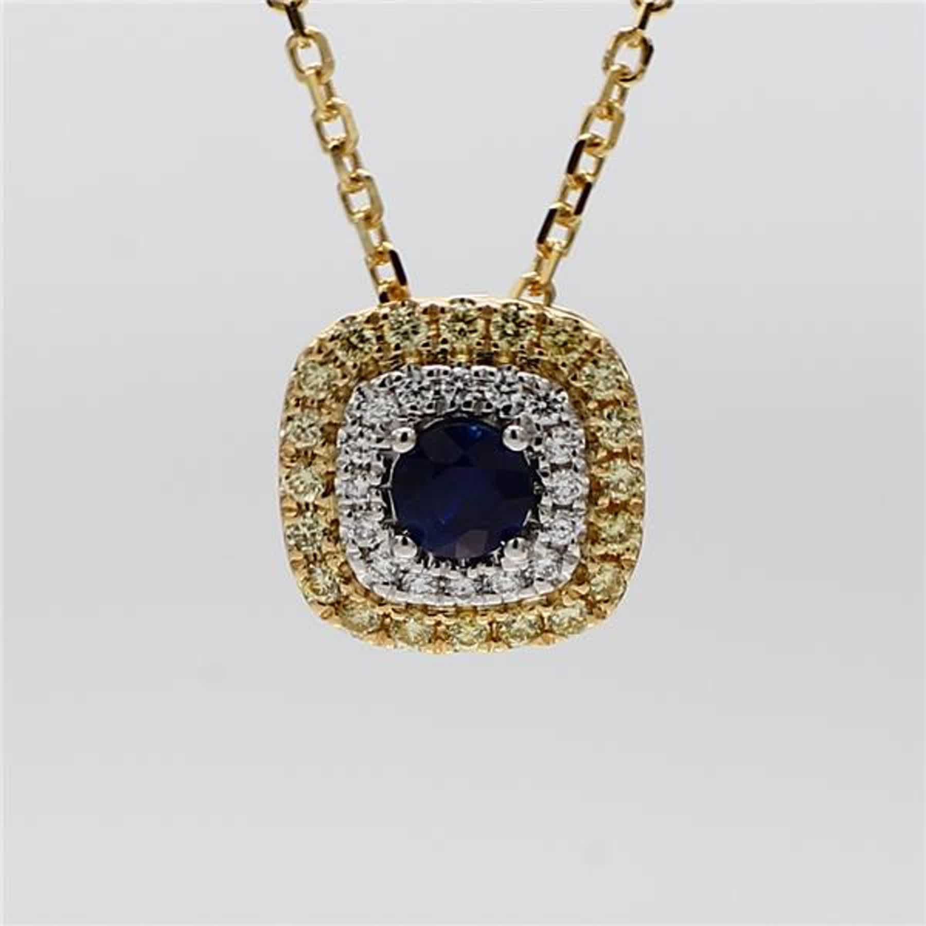 RareGemWorld's classic sapphire pendant. Mounted in a beautiful 18K Yellow and White Gold setting with a natural round cut blue sapphire. The sapphire is surrounded by natural round yellow diamond melee and natural round white diamond melee. This