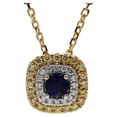 Natural Blue Round Sapphire and Yellow/White Diamond .61 Carat TW Gold Pendant