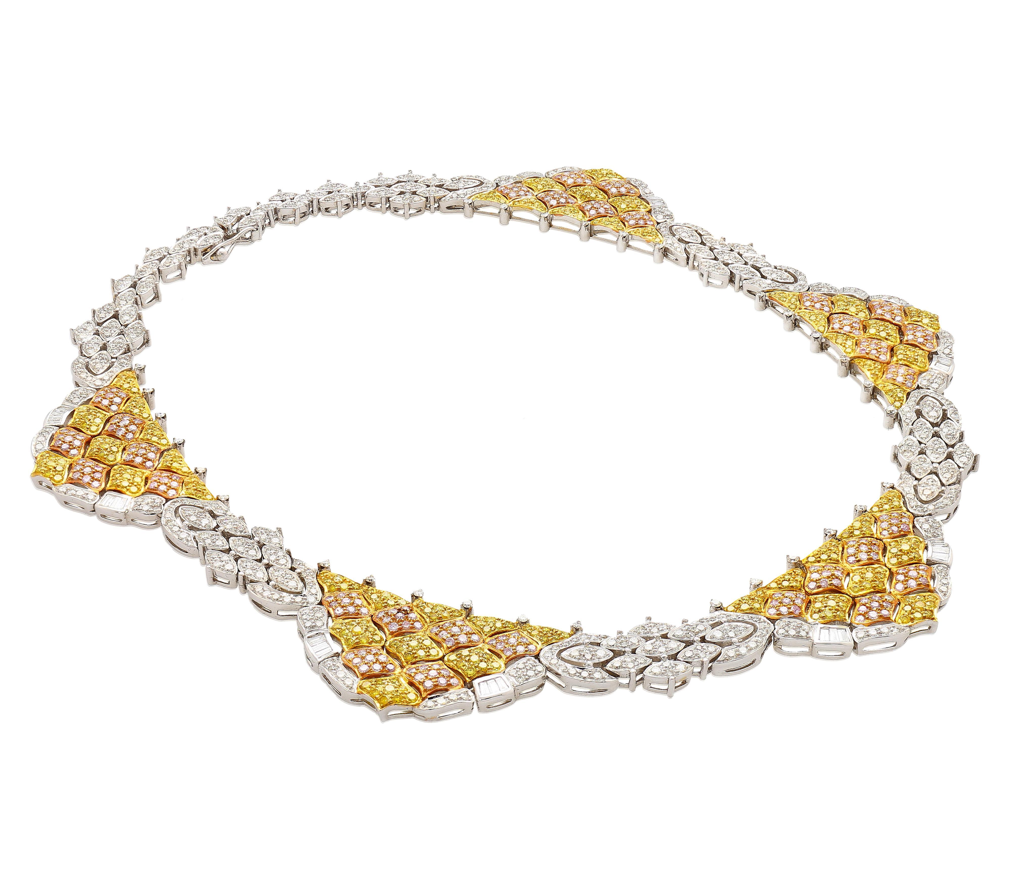 35 Carat Natural Pink, White, & Yellow Diamond Pave Necklace Choker in 18K Three-Tone Gold. 

An intricate necklace featuring a hand linked display of multi colored diamonds that total 35.50 carats. The diamonds consist of round-cut white, yellow,