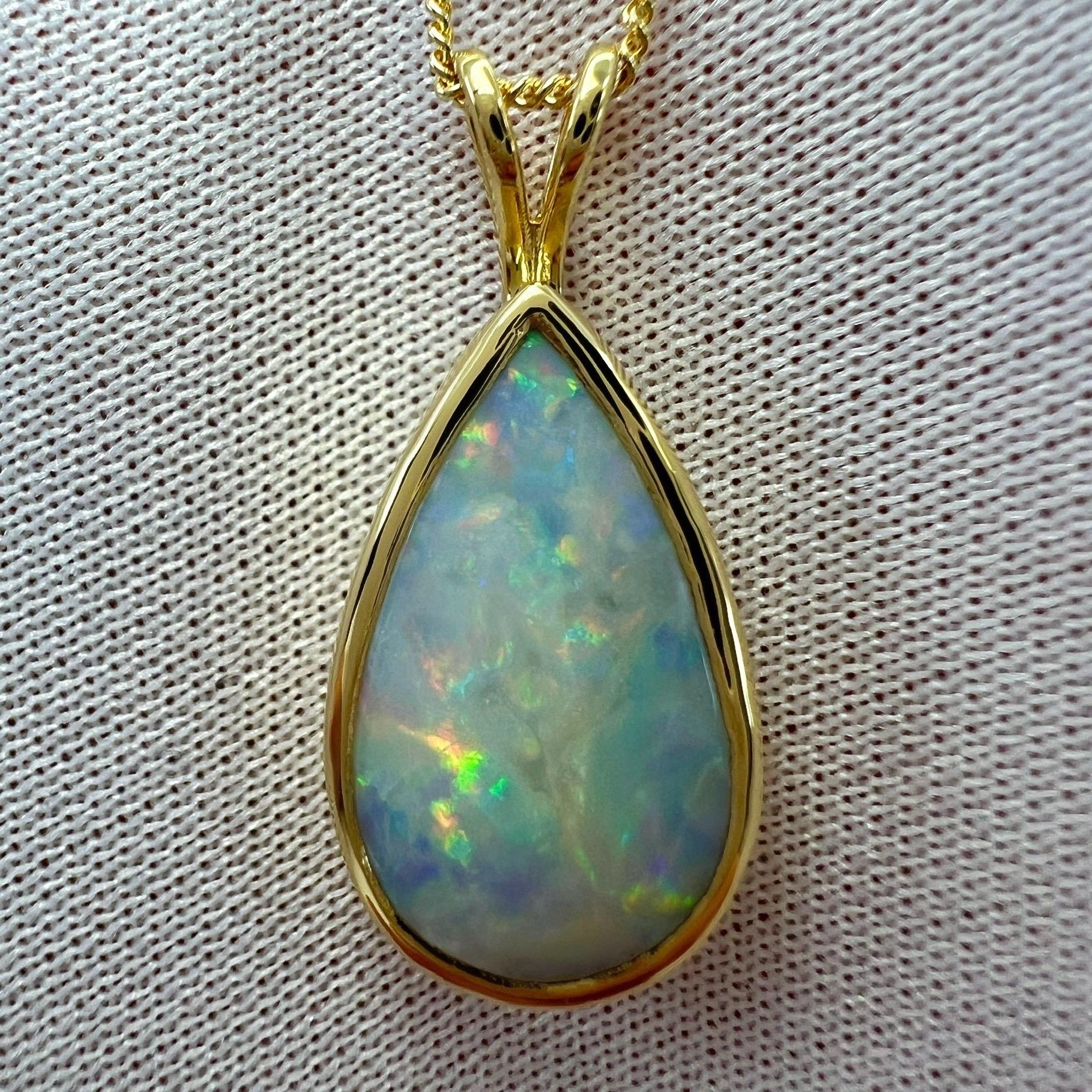 Natural Australian Cooper Pedy White Opal 18k Yellow Gold Solitaire Pendant Necklace.

3.55 Carat opal with beautiful play of colour and an excellent pear cabochon cut. Set in a fine 18k yellow gold rubover bezel pendant. Stunning opal with an