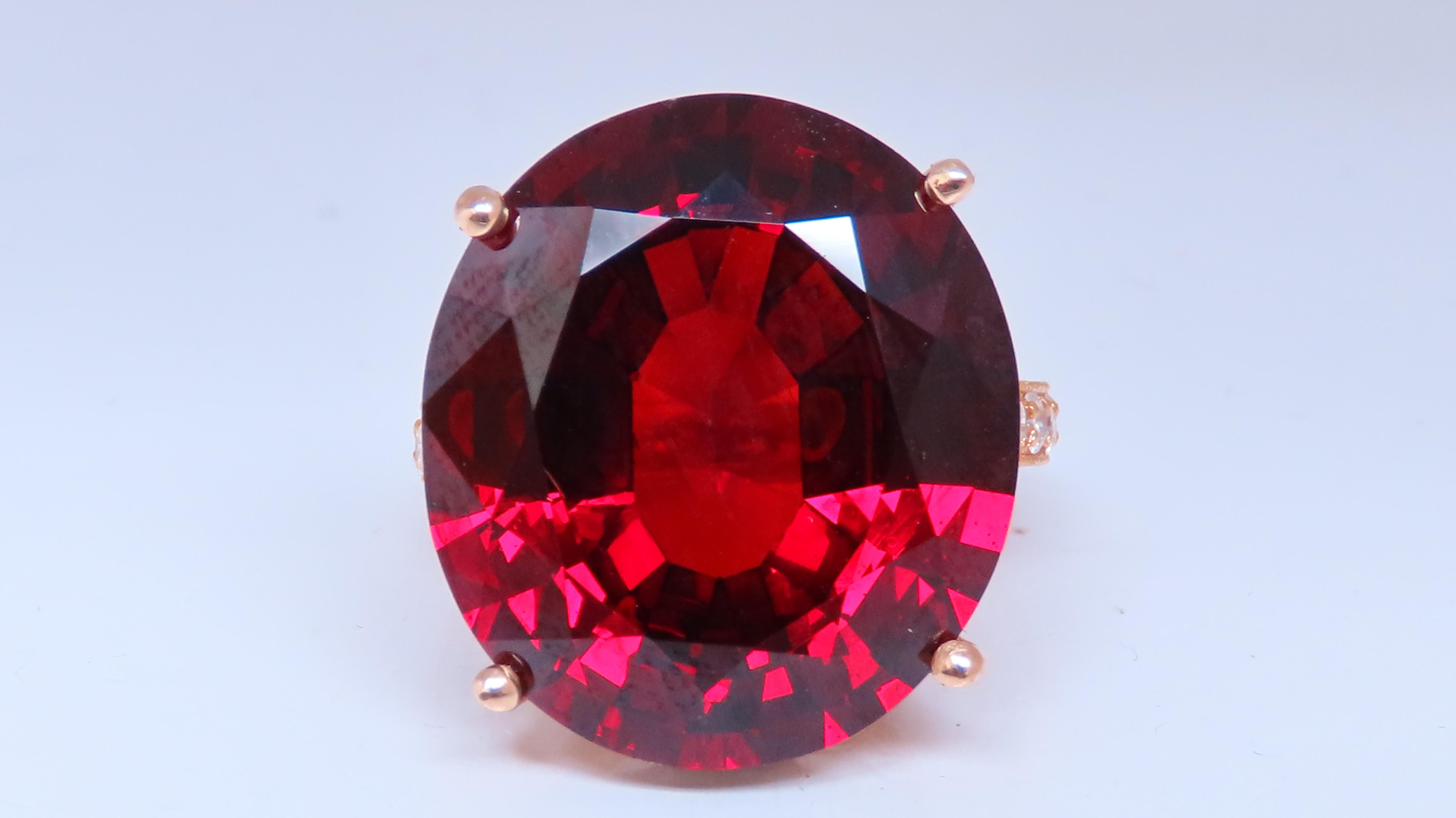 32.75ct. Natural Spessartite Garnet diamond ring.
21.50 X 19mm- 
Natural Diamonds encrusted throughout in French pave style setting- all done by hand!
F-G color, Vs-2 clarity.
14kt. yellow gold & 12.6 grams.
Size 7.