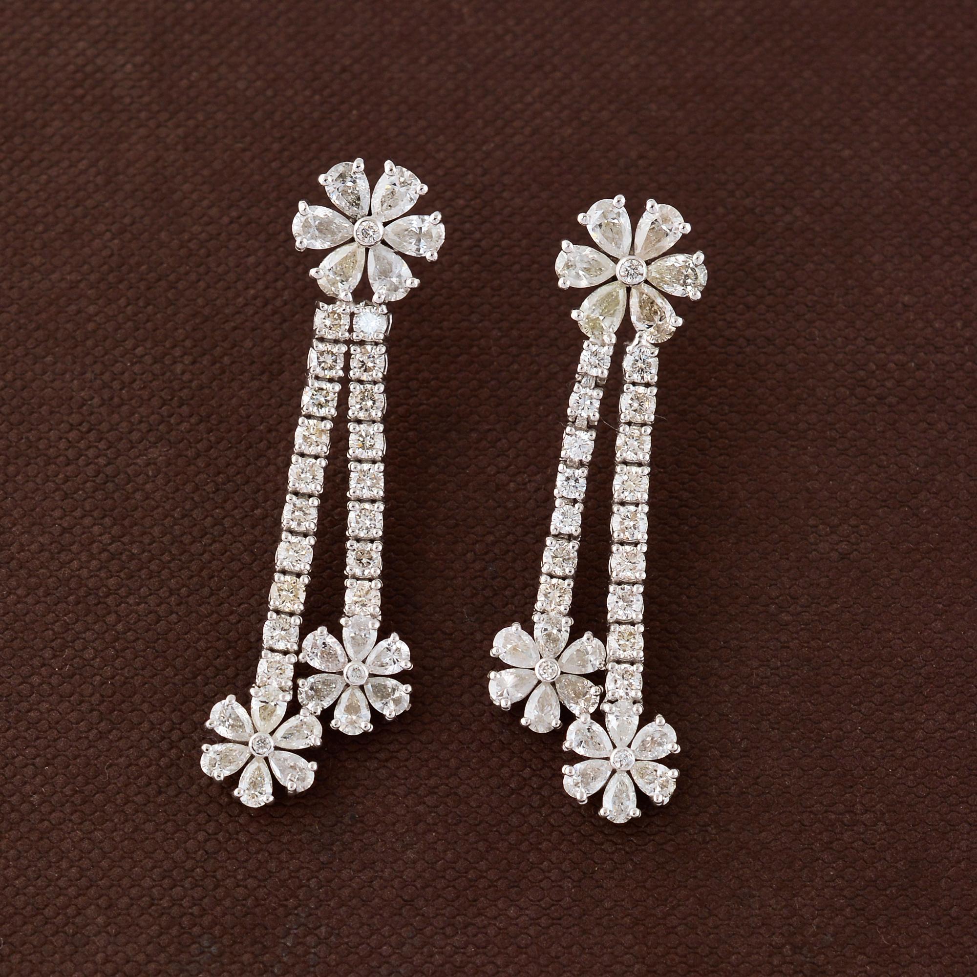 Indulge in the timeless allure of these exquisite Natural 3.6 Ct H/SI Diamond Dangle Earrings, crafted with meticulous attention to detail. Set in lustrous 18 karat white gold, these earrings epitomize elegance and luxury.

Item Code :-