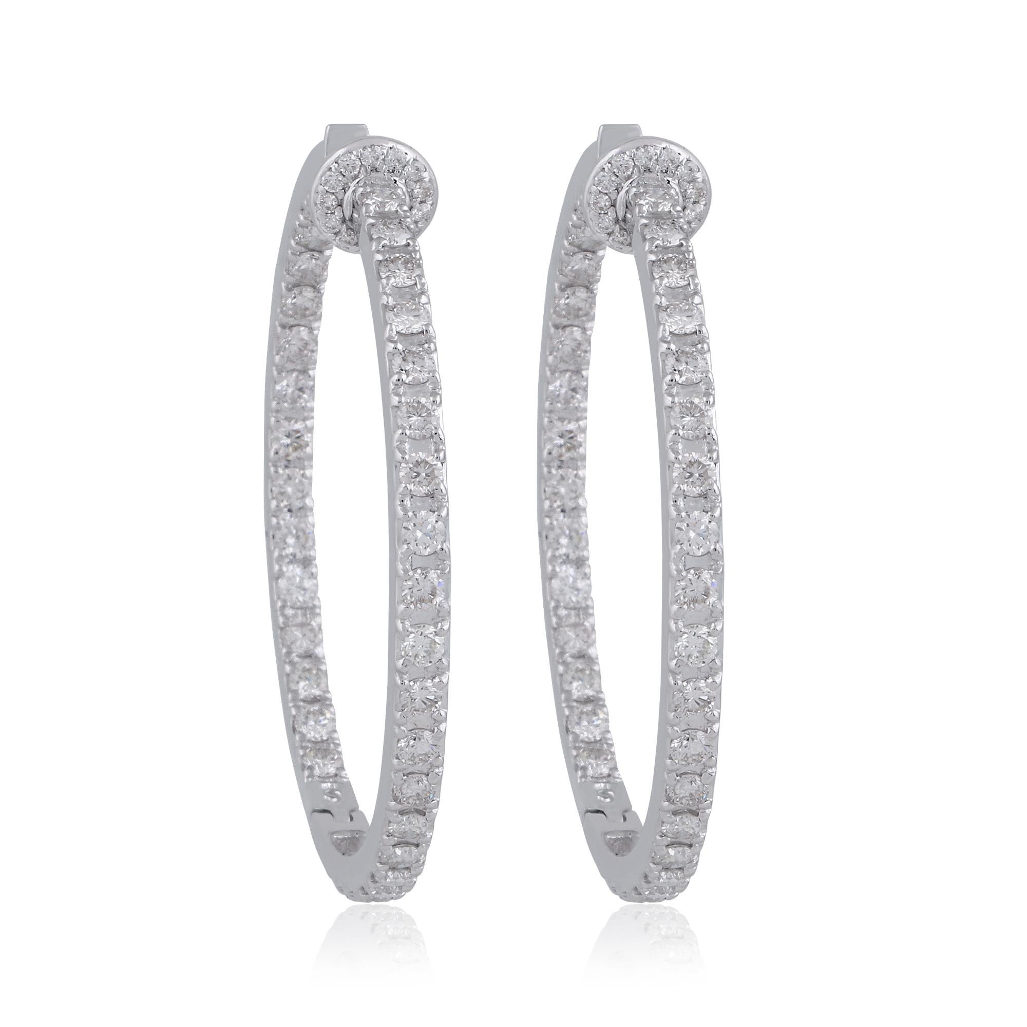 Indulge in the timeless elegance and unparalleled luxury of these Natural 3.60 Carat Round Diamond Hoop Earrings, meticulously crafted in 18 Karat White Gold. Each pair embodies sophistication and refinement, elevating any ensemble with its radiant