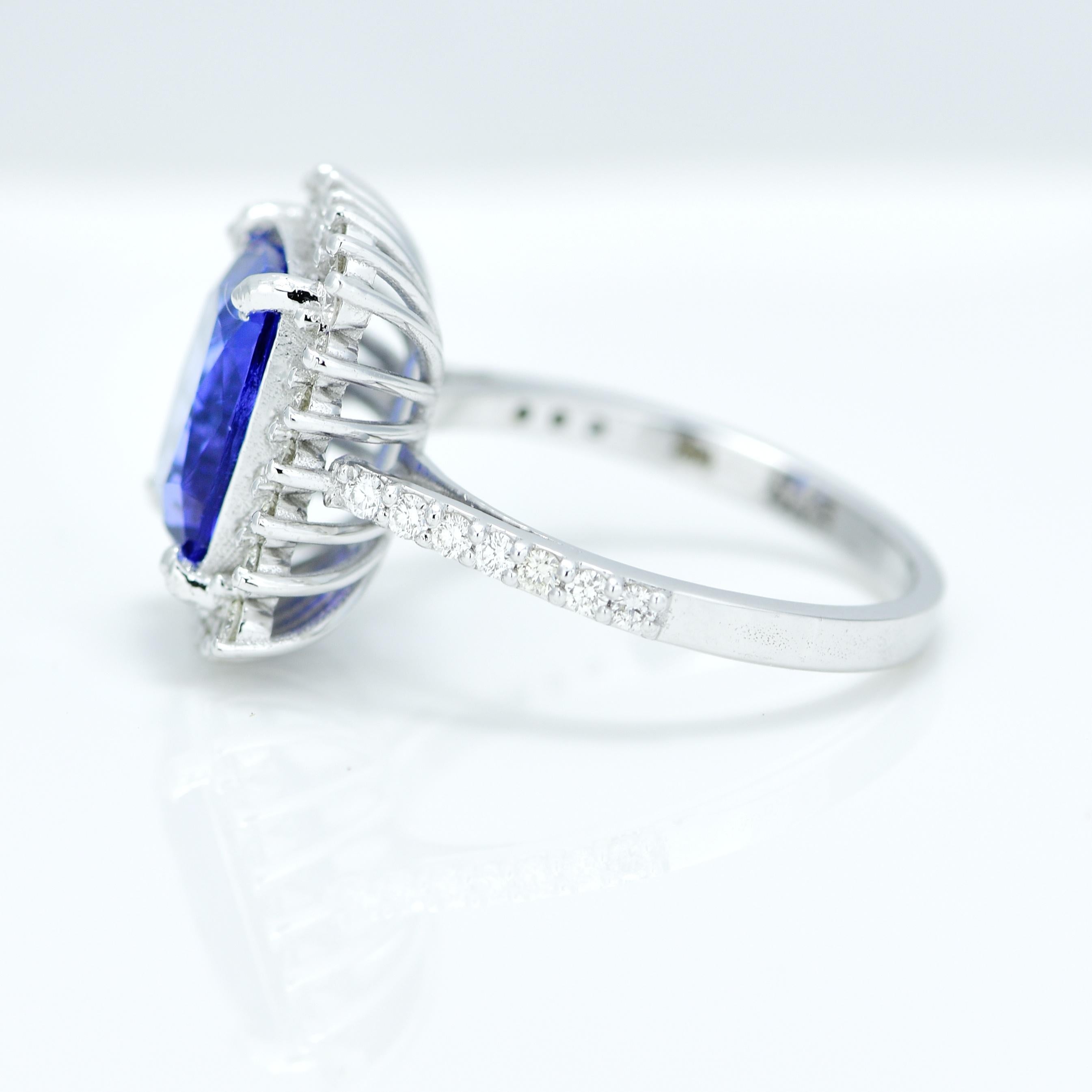 Stunning Violetish Blue Tanzanite and Diamond halo ring.

Centre Stone - Natural Tanzanite, 
Centre Stone Weight - 3.63 Carat, 
Centre Stone Shape & Cut - Long Cushion Step Cut
 
Total Number of Diamonds - 38, 
Diamonds Carat Weight - 0.56
