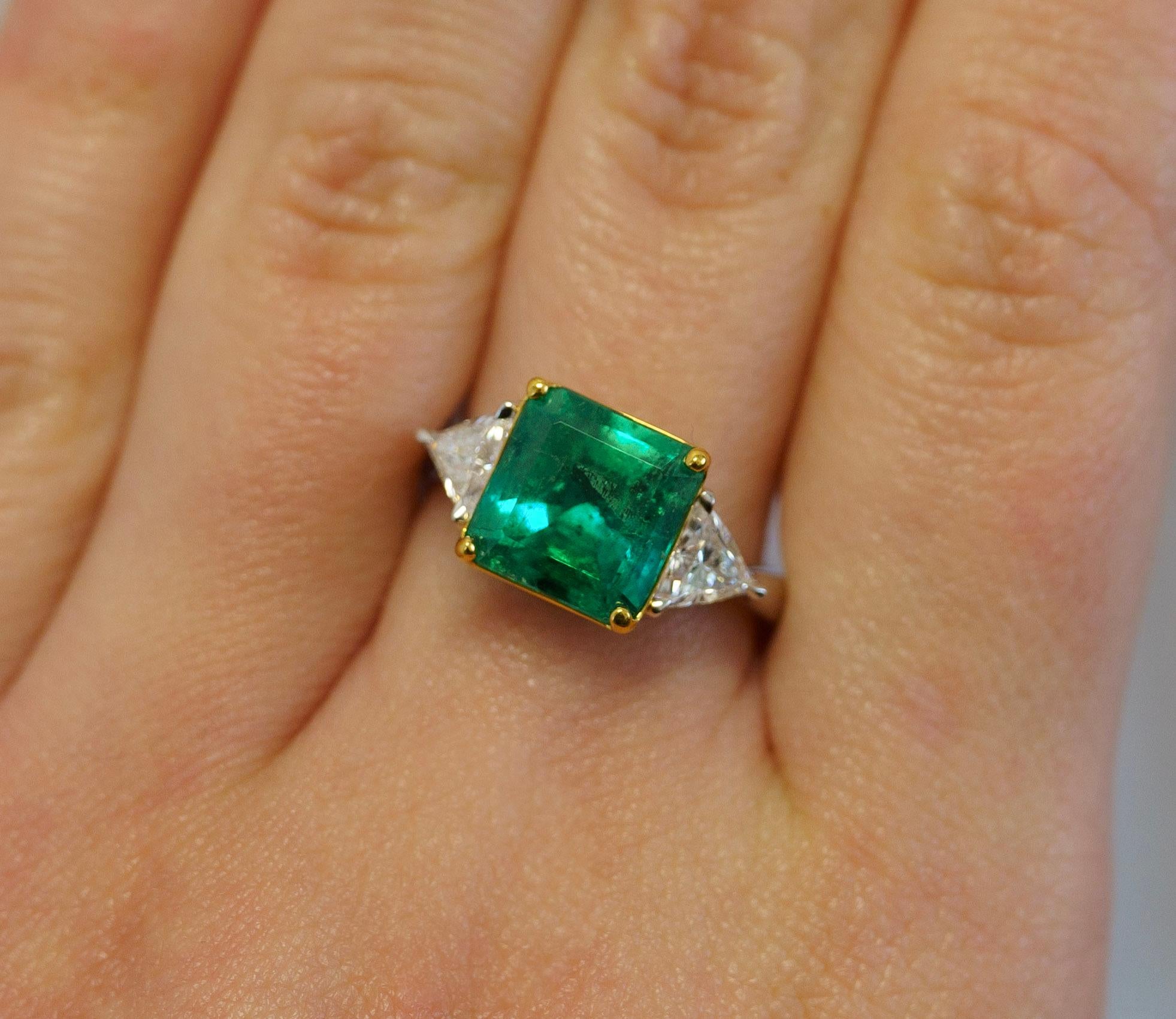 Natural 3.76 Carat Colombian Emerald with Trilliant Cut Diamond Side Stone 3-Stone Ring in 18K Gold. Complete with GRS and GIA certification.

The emerald center stone bears a rich deep green color saturation with minor-moderate oil treatment.