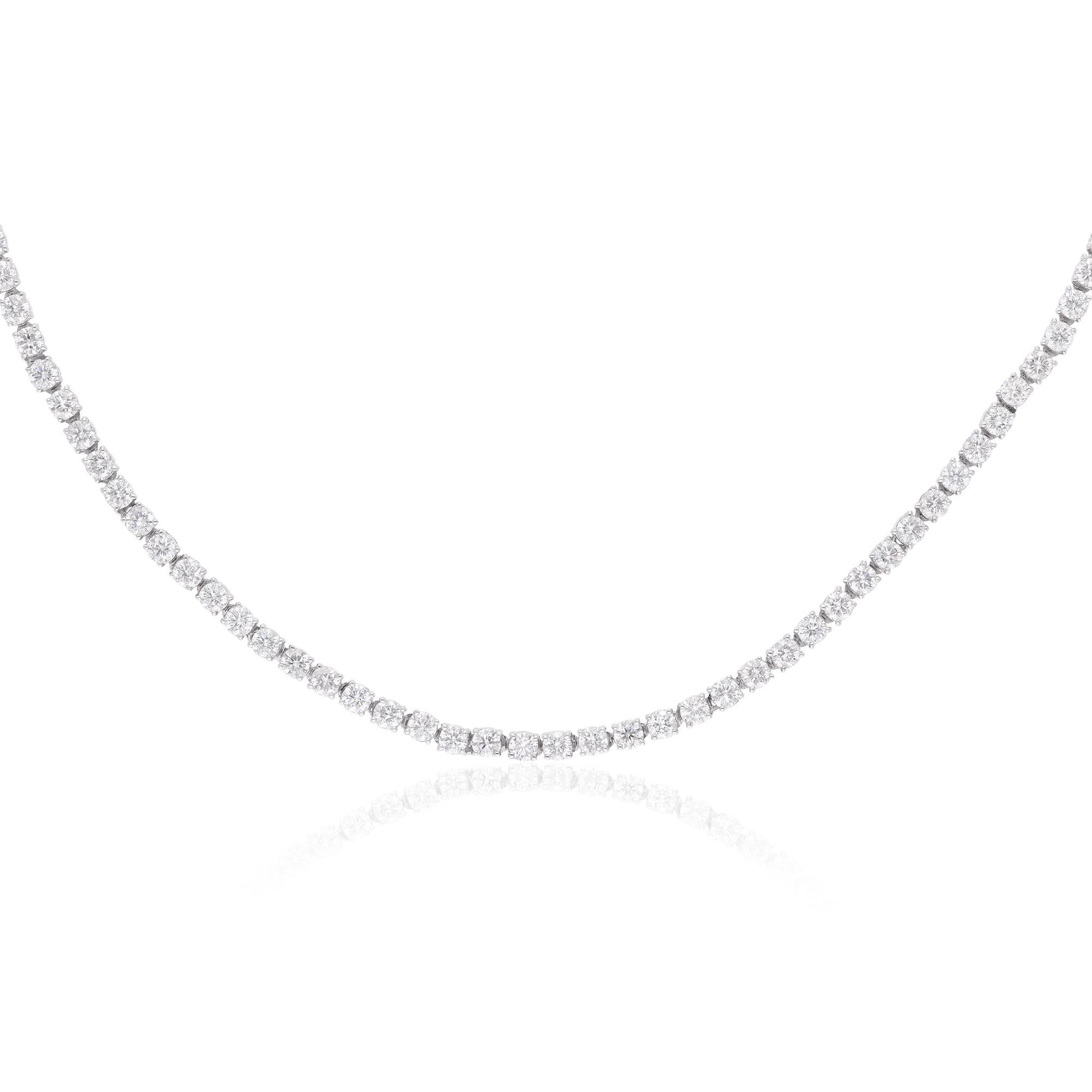 The round diamond is delicately suspended from a sleek white gold chain, adding a touch of modernity and refinement to the design. The solid 18 karat white gold setting provides a luxurious backdrop for the diamond, enhancing its brilliance and