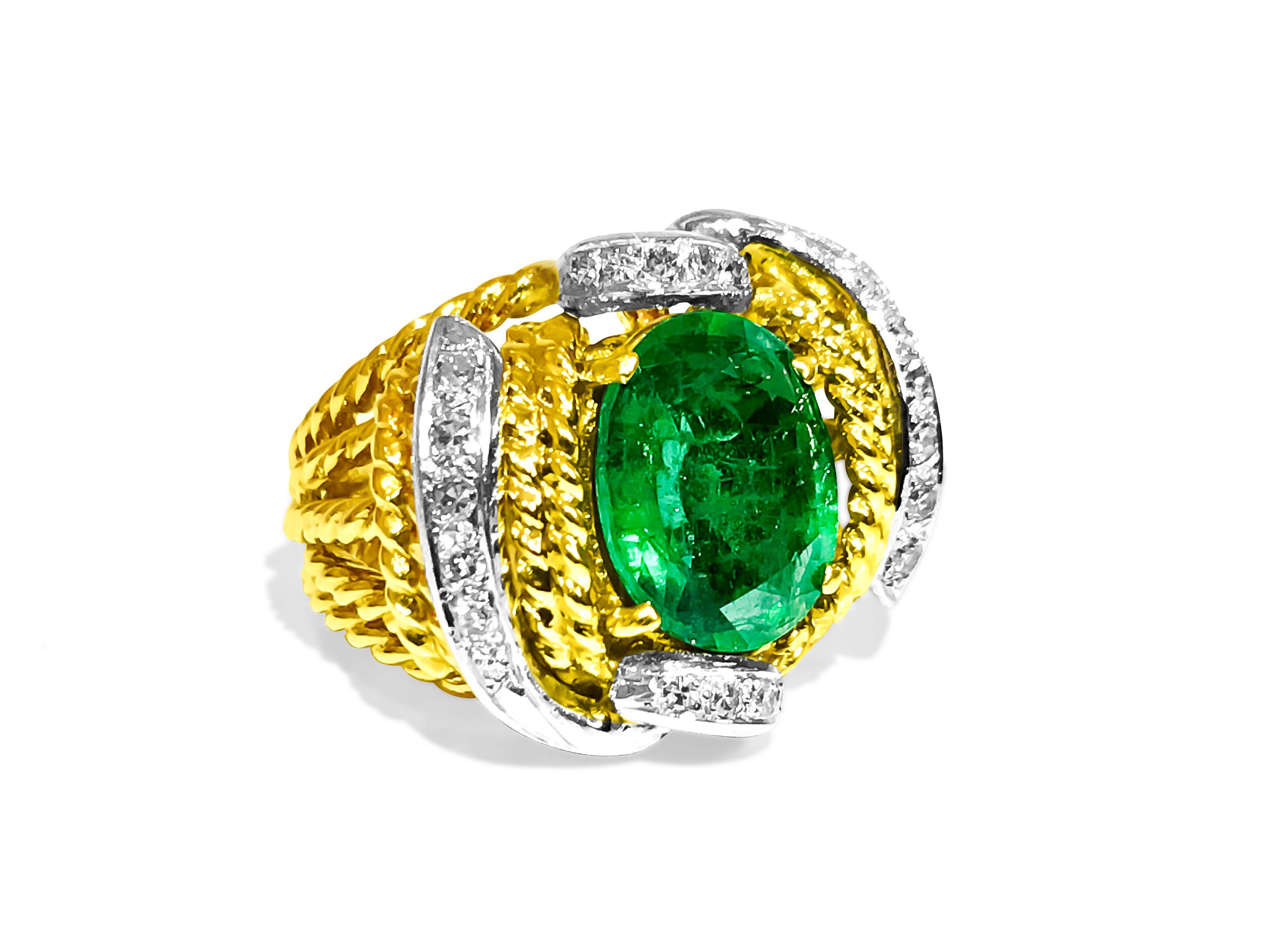Fashioned from both 18K yellow and white gold, this two-tone ring showcases a stunning 3.50 carat oval-cut emerald, securely set in prongs, alongside 0.36 carats of round brilliant cut diamonds, boasting VS clarity and F-G color. With meticulous