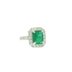 Natural 3.95 Carat Emerald & Natural Diamond Halo 18-Karat Ring In Stock