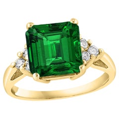 Bague en or jaune 14 carats, émeraude taille émeraude 4 carats et diamants 0,30 carat