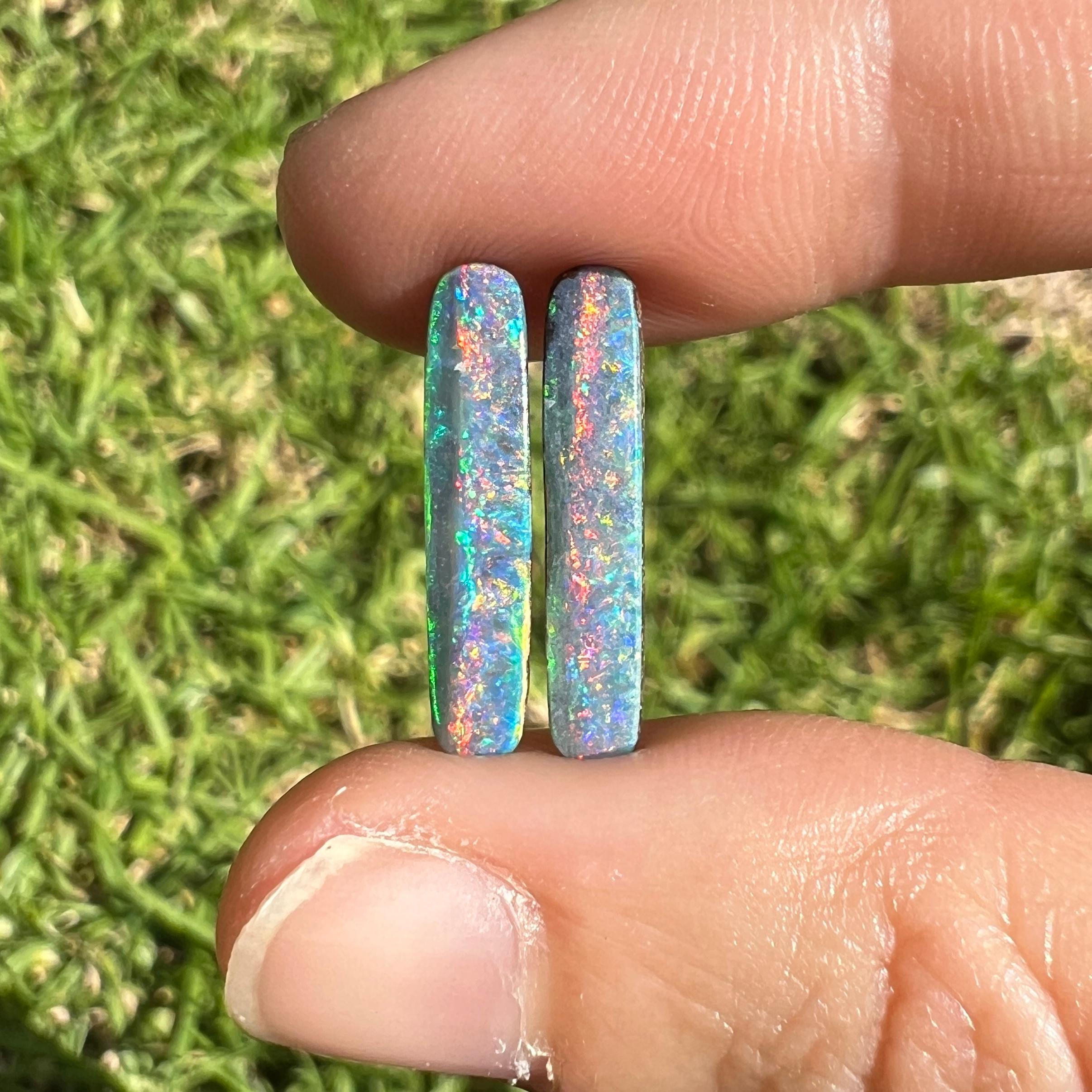 
Introducing our exquisite narrow rectangle black boulder pair! This rare 3.37 Ct Australian black boulder opal pair was mined by Sue Cooper at her Yaraka opal mine in western Queensland, Australia in 2021. Sue processed the rough opal herself and