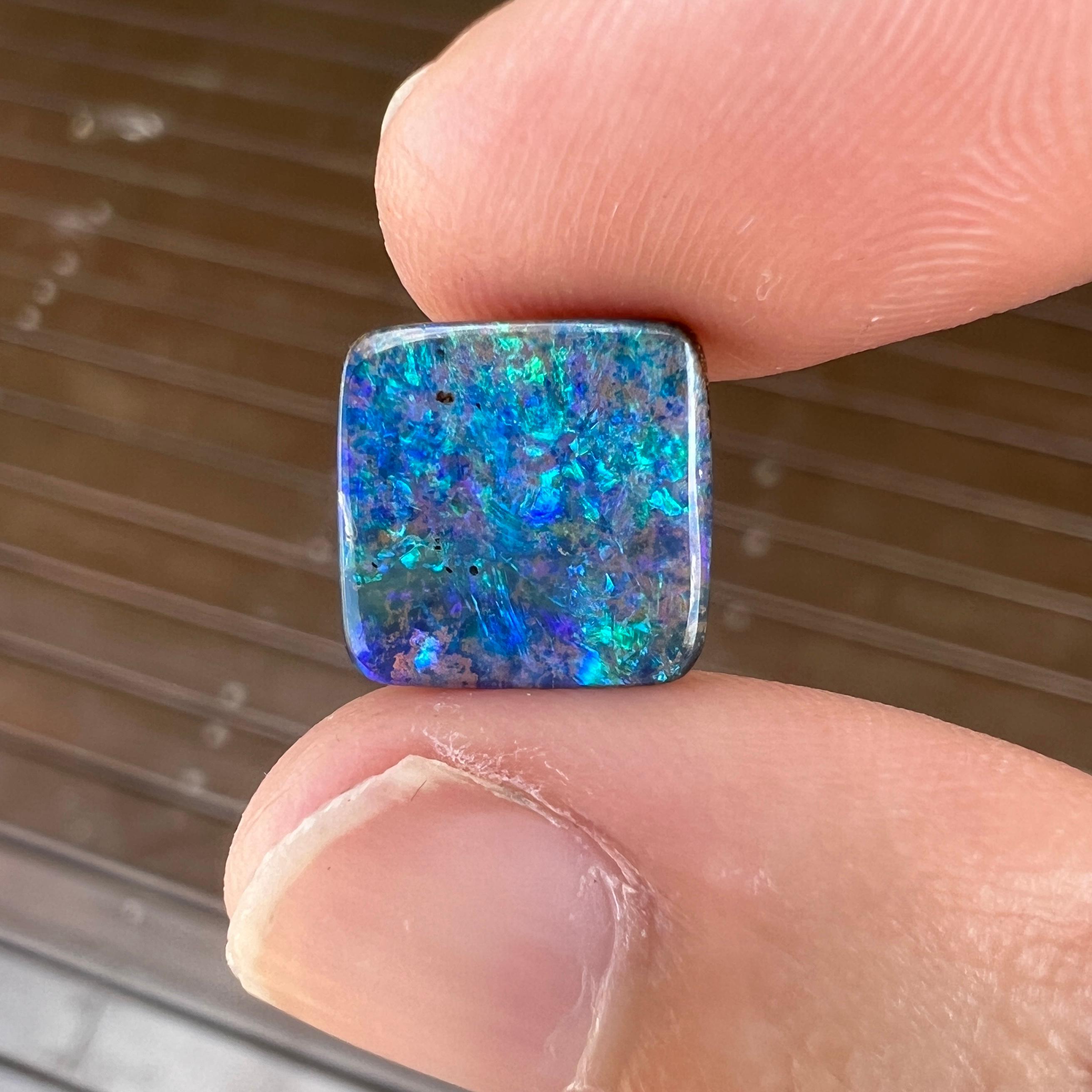 This beautiful 4.38 Ct Australian boulder opal was mined by Sue Cooper at her Yaraka opal mine in western Queensland, Australia in 2023. Sue processed the rough opal herself and cut into into a square shape. We especially love the ocean blues and