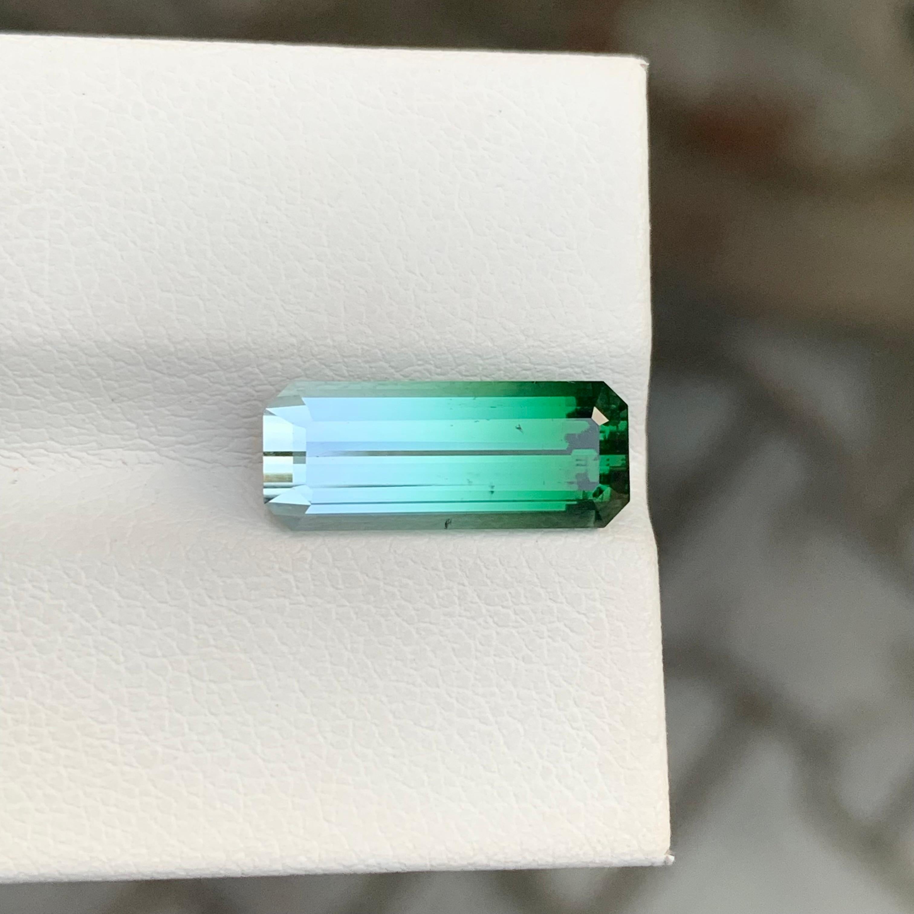 Arts and Crafts Natural 4.45 Carat Faceted Bi Colour Tourmaline Long Emerald Shape Gemstone For Sale