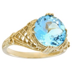 Naturel 4,5 carats Bague filigranée en or jaune 9K de style vintage avec topaze bleue