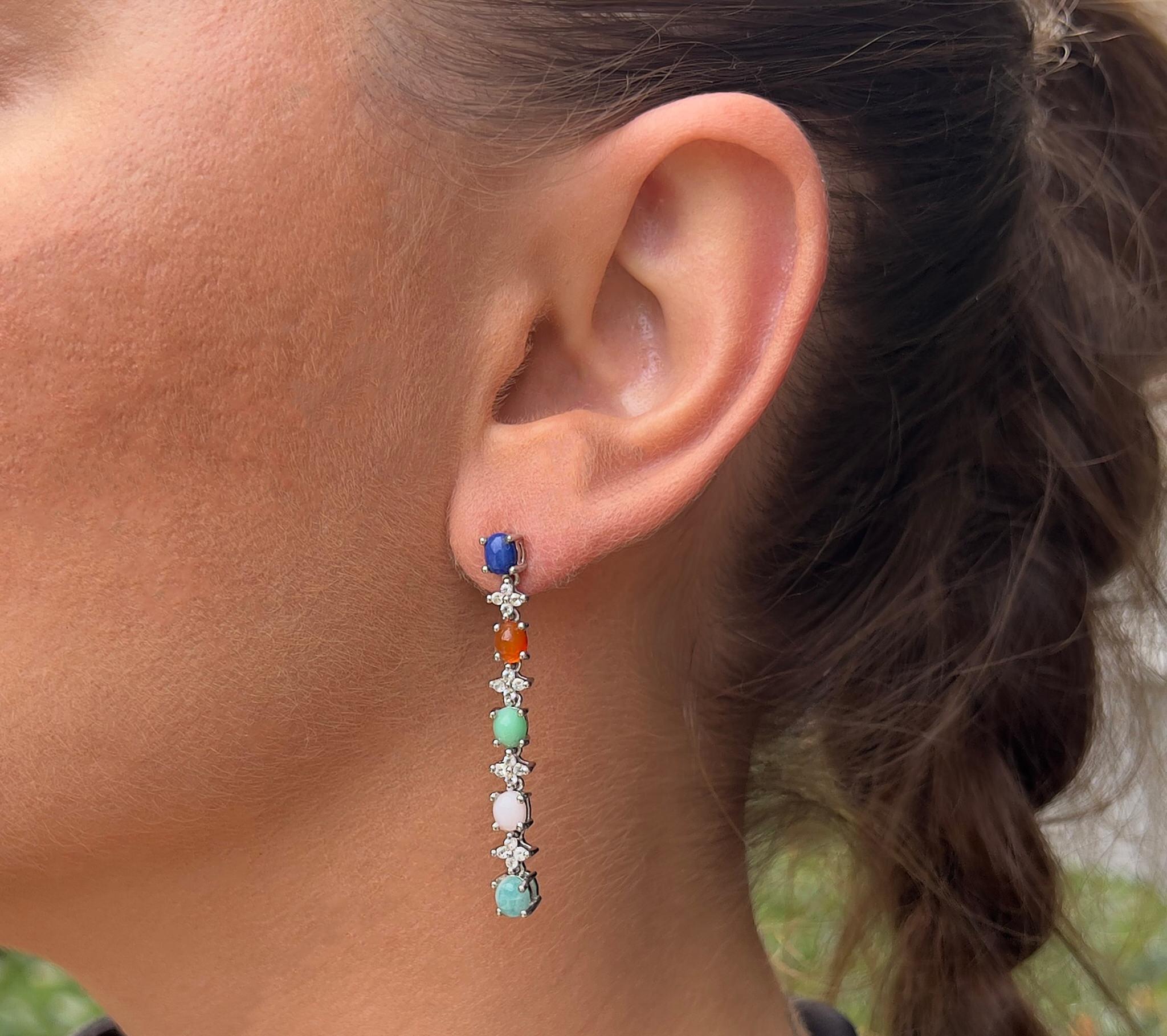 It comes with the appraisal by GIA GG/AJP
All Gemstones are Natural
Lapis, Pink Opal, Crysopharse, Amazonite, Carnelian, White Topaz
Total Carat Weight = 4.50 Carats
Cut: Mixed Cut
Metal: Sterling Silver (Rhodium Plated)
Back Finding: Post With