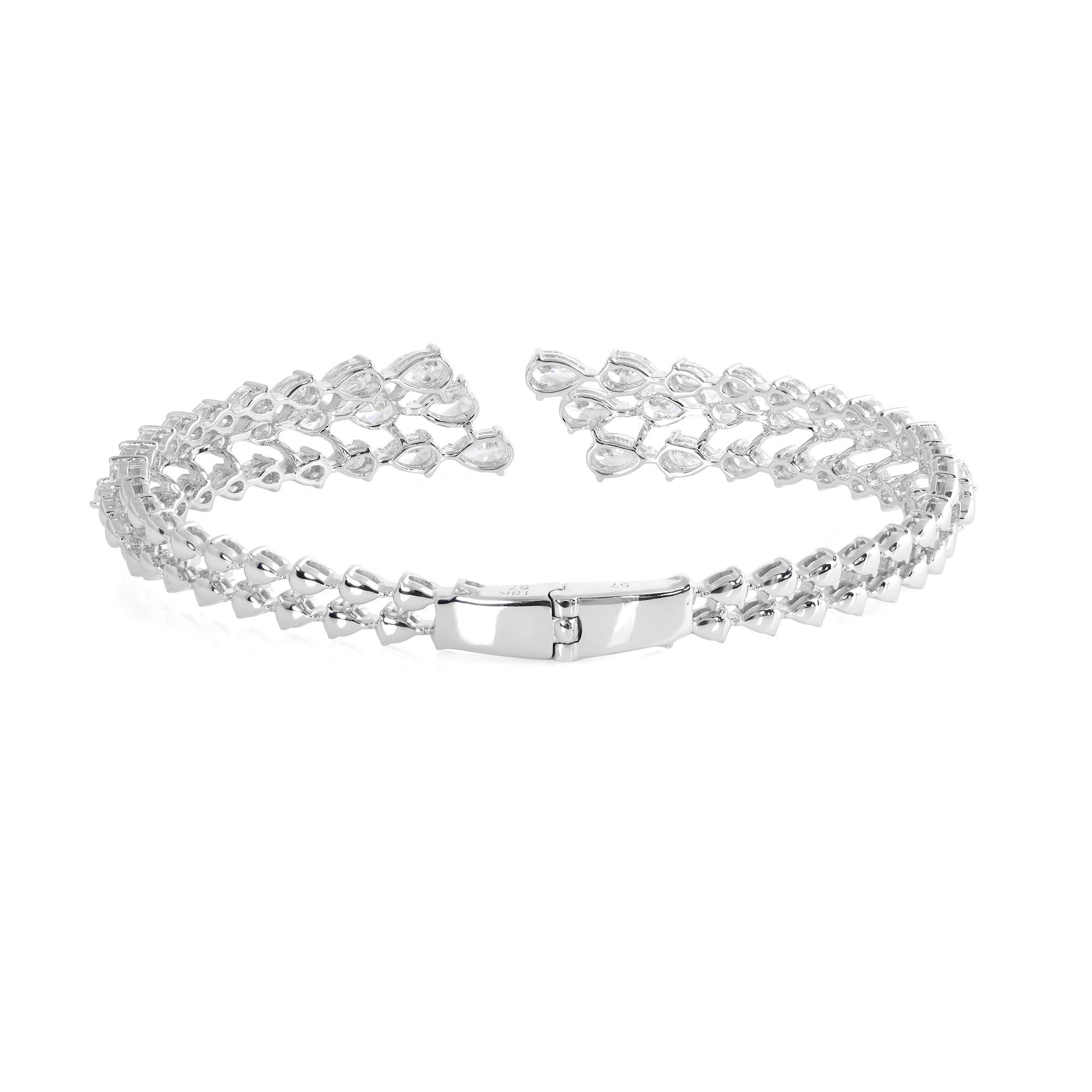 Experience the pinnacle of luxury and glamour with this mesmerizing Natural 4.55 Carat Pear Diamond Cuff Bangle Bracelet, crafted in radiant 18 karat white gold. This exquisite piece of jewelry epitomizes sophistication, showcasing the unparalleled