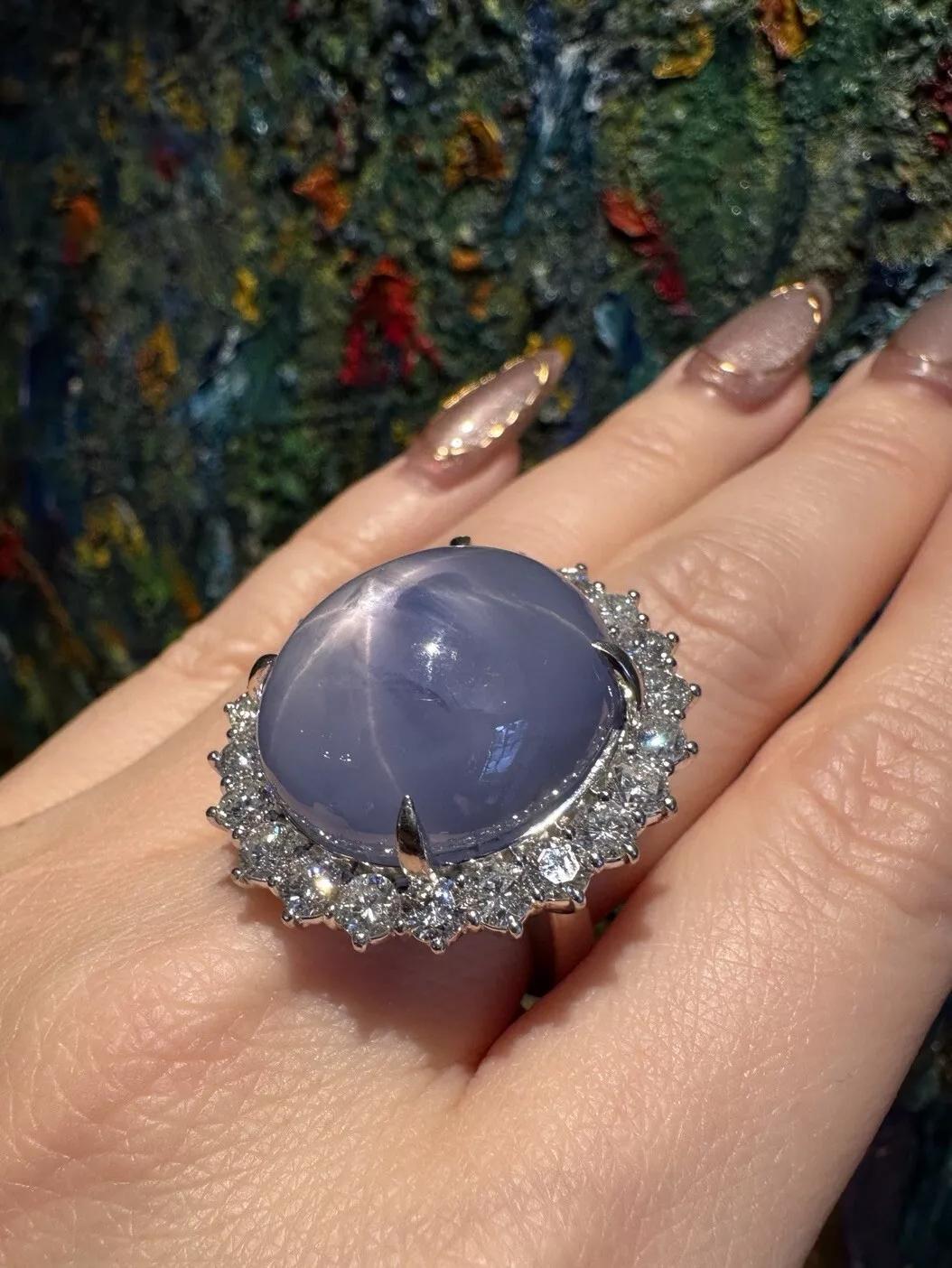 Natural 45.82 carat Star Sapphire and Diamond Ring in Platinum 

Large Star Sapphire and Diamond Ring features a natural Oval Cabochon Blue Star Sapphire with a defined asterism (star) weighing 45.82 carats surrounded with Round Brilliant Diamonds