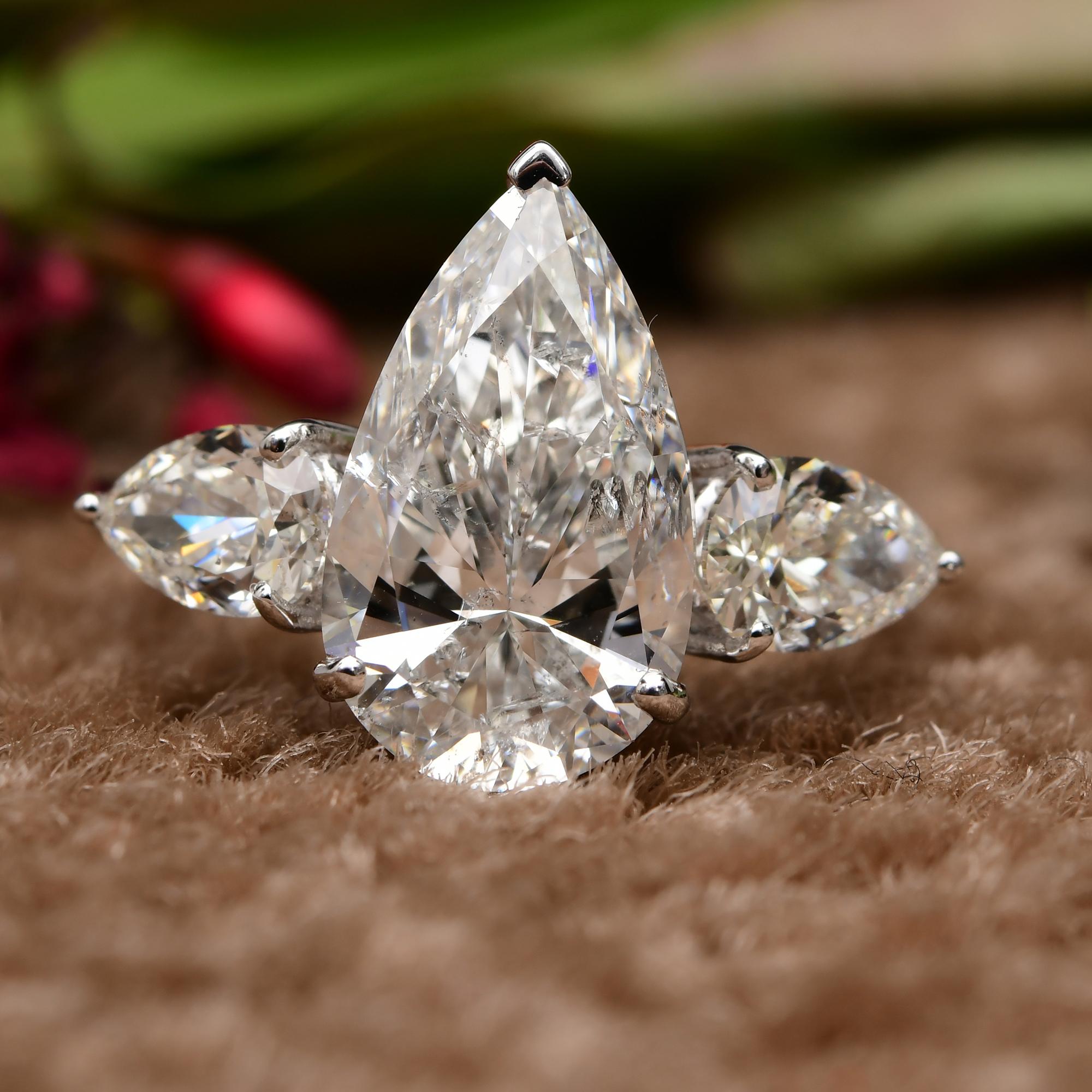 Modern Natural 4.62 Carat SI/H Pear Shape Diamond Three Stone Ring 14 Karat White Gold For Sale