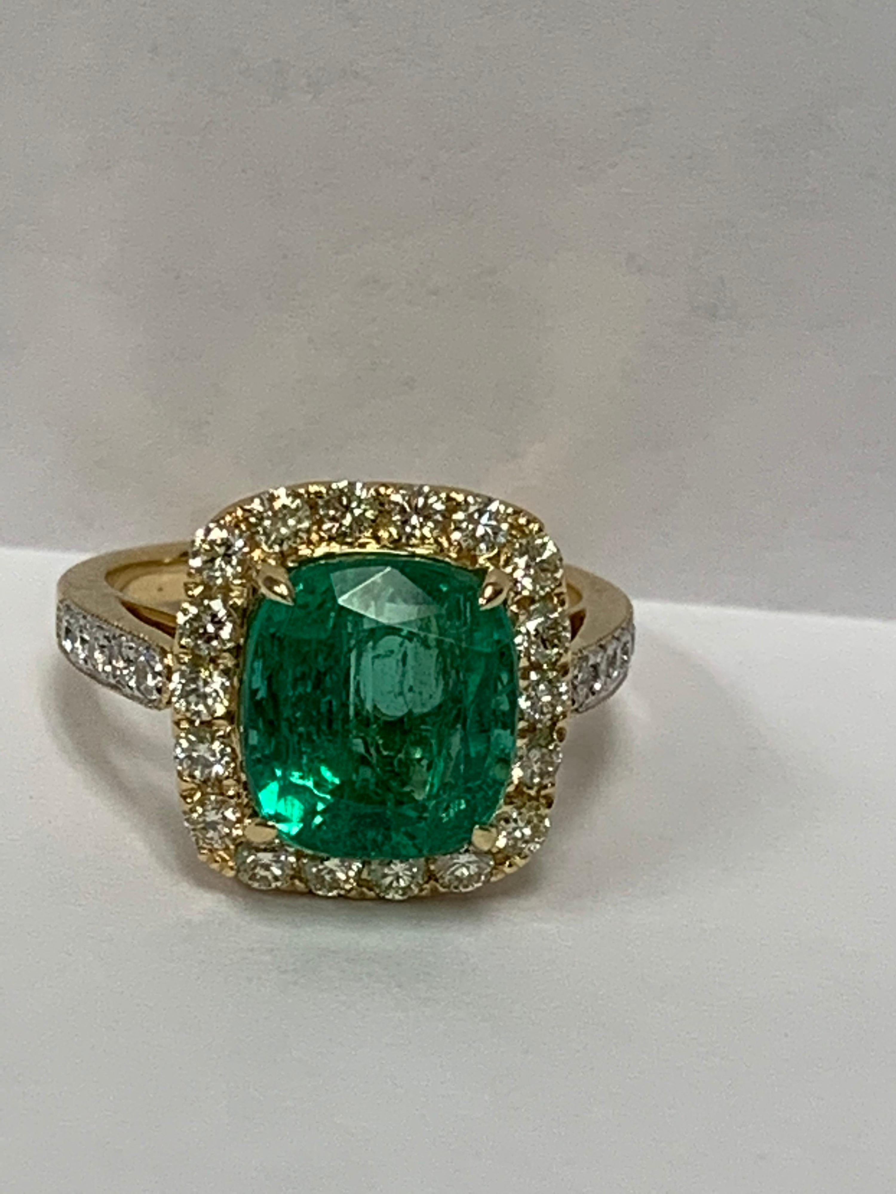 Natural 4..80 Carat Cushion Shape  Emerald and 0.20 Carat white and 0.73 Carat Yellow Diamond set in 18 Karat Yellow gold is handcrafted one of a kind ring . The Emerald has some inclusion , usually all emerald contain some inclusion . The size of