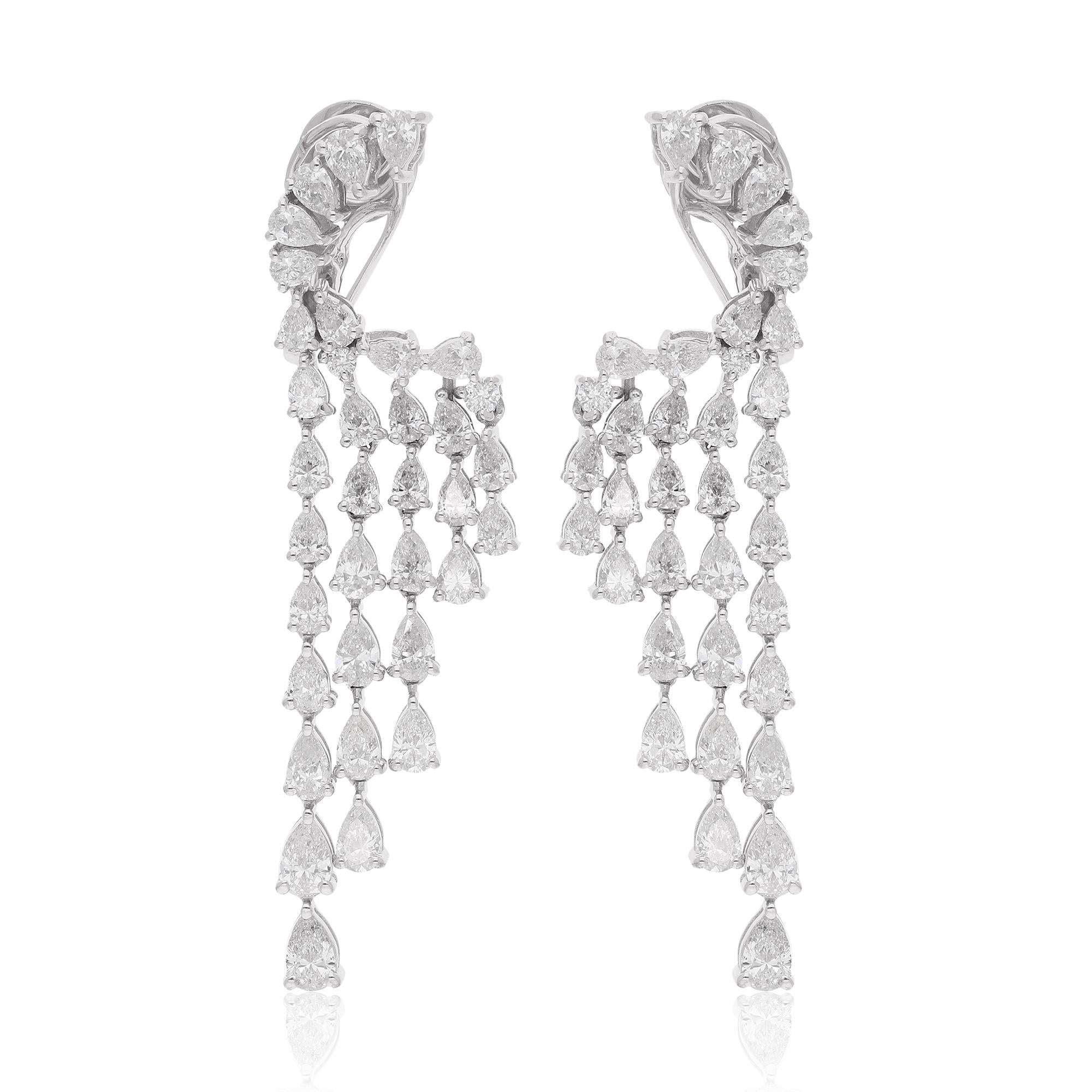We're describing a pair of dangle earrings made from 14 karat white gold, featuring a combination of pear-shaped and round diamonds with a total weight of 4.93 carats. This jewelry is classified as fine jewelry due to the high-quality materials and
