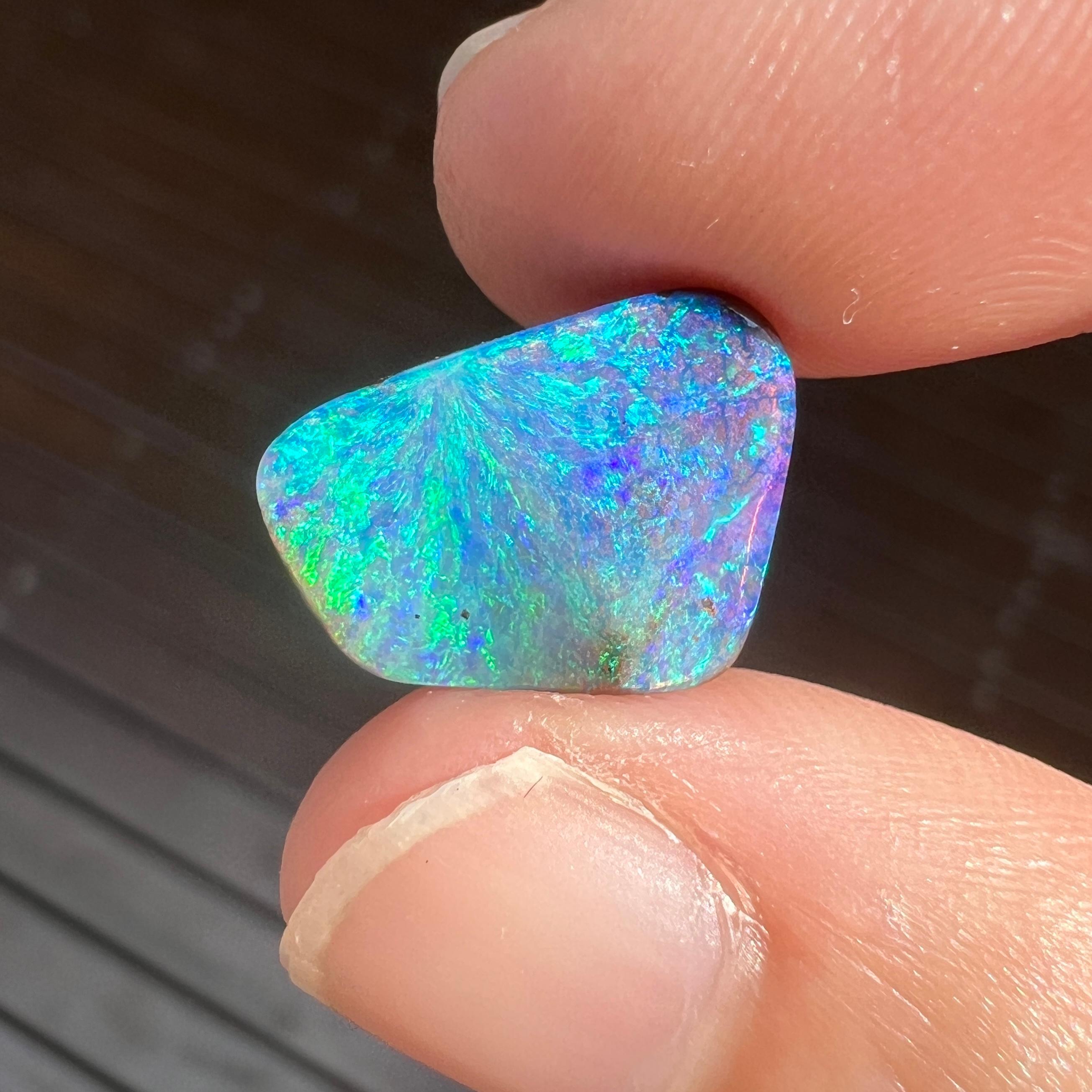 This beautiful 4.98 Ct Australian boulder opal was mined by Sue Cooper at her Yaraka opal mine in western Queensland, Australia in 2021. Sue processed the rough opal herself and cut into into an organic, free-form shape. We especially love the blue,