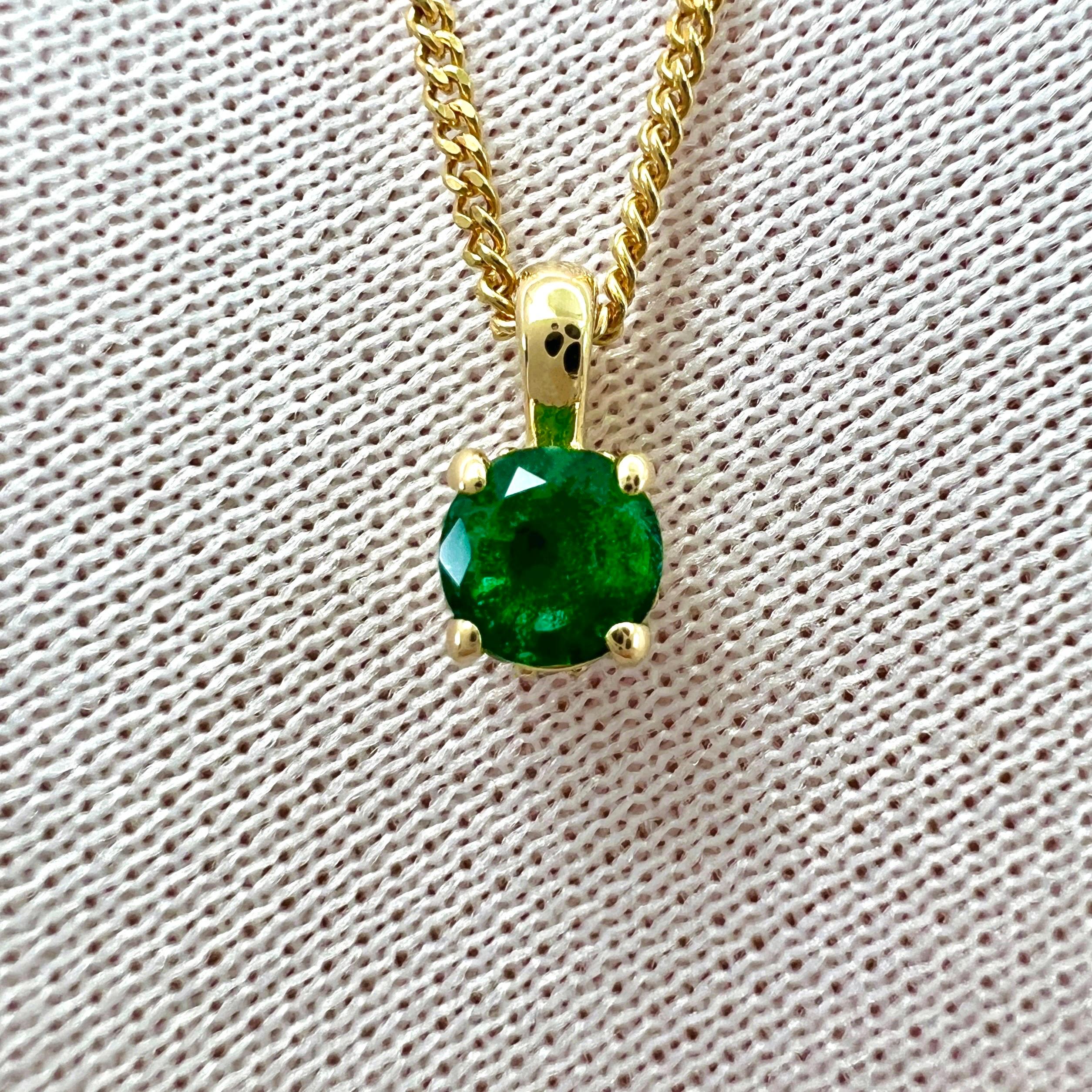 Fine Natural Vivid Green Round Cut Emerald & Diamond 18k Yellow Gold Hidden Halo Pendant Necklace.

This pendant is set with a beautiful 4mm natural emerald with a bright vivid green colour and very good clarity. A very clean stone with only some