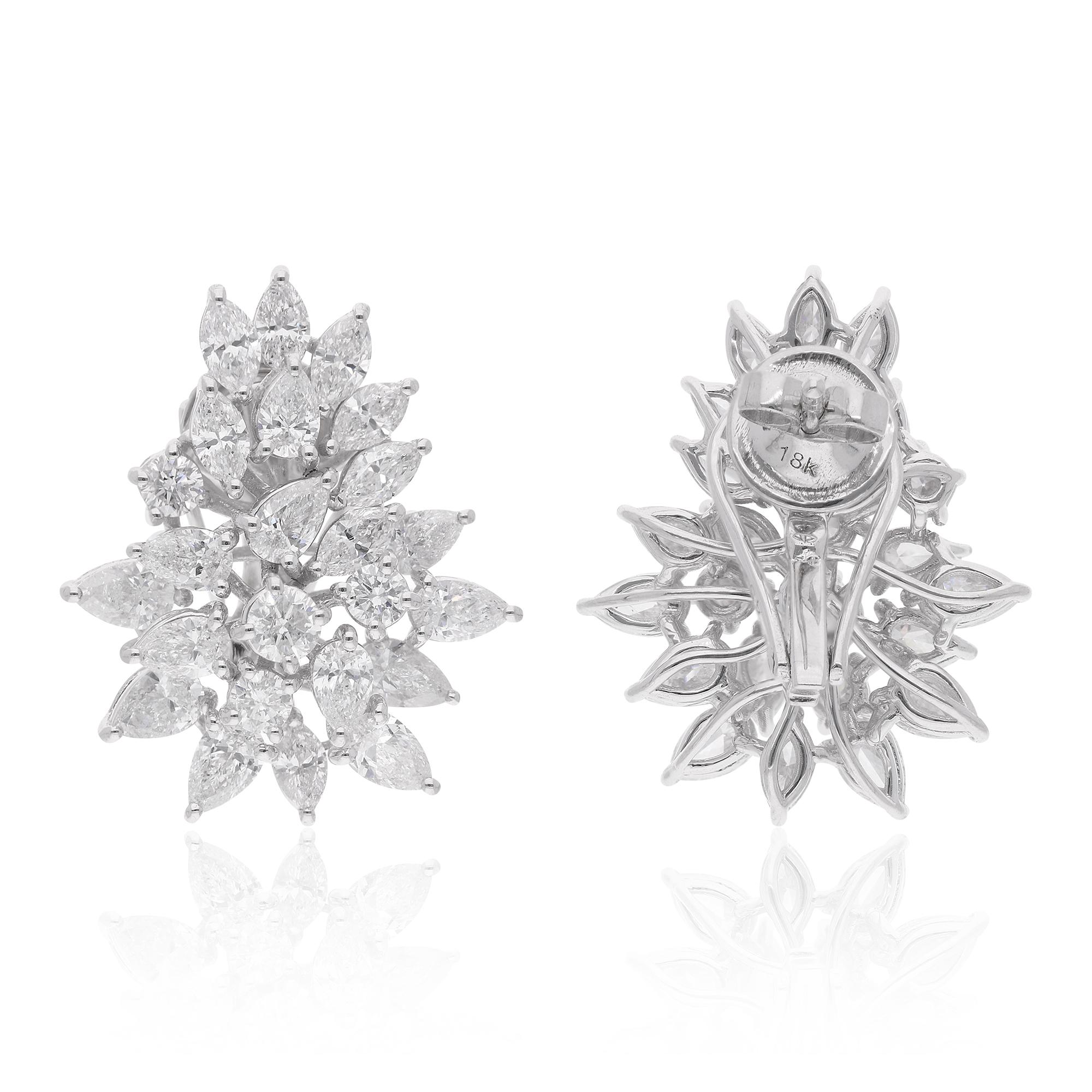 Crafted with precision and attention to detail, these earrings are designed to make a statement while remaining comfortable and secure to wear. The lustrous 14 karat white gold setting provides the perfect backdrop for the dazzling diamonds,