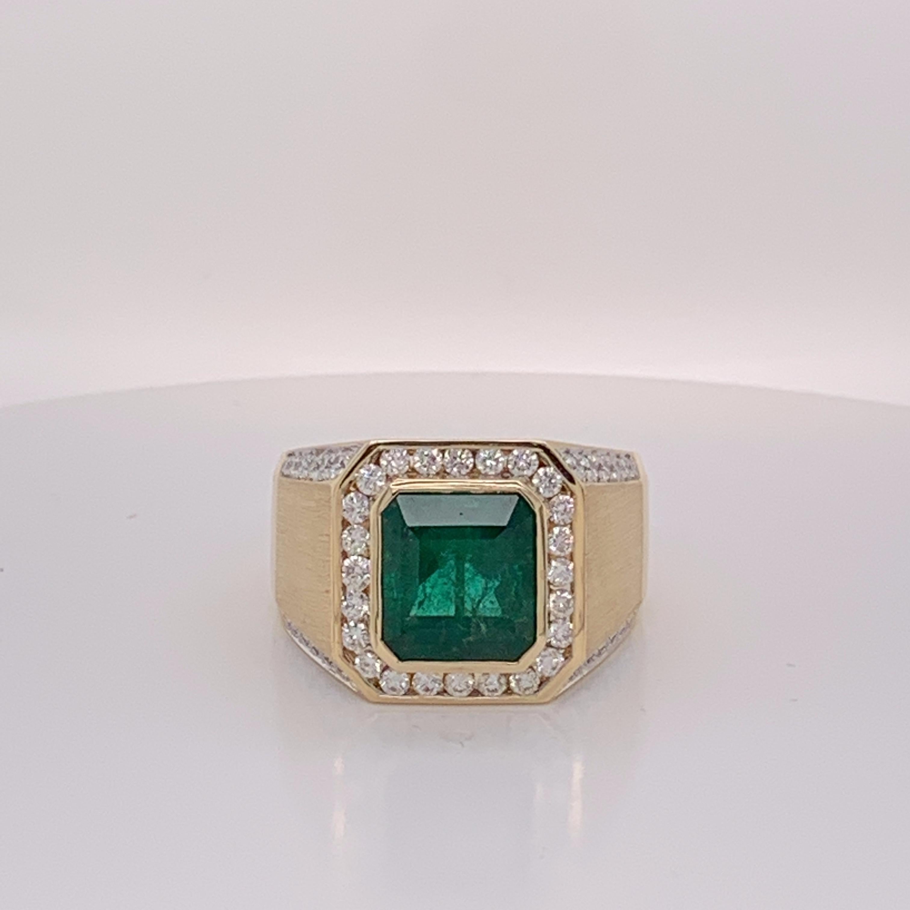 Natural Octagon 5.14 Carat  Emerald and 1.18 carat round  white Diamond  set in 14 Karat Gold is one of a kind Hand crafted Mens ring . This is heavy mount and custom designed Ring . The size is 12 but can be resized if needed.

If you need any