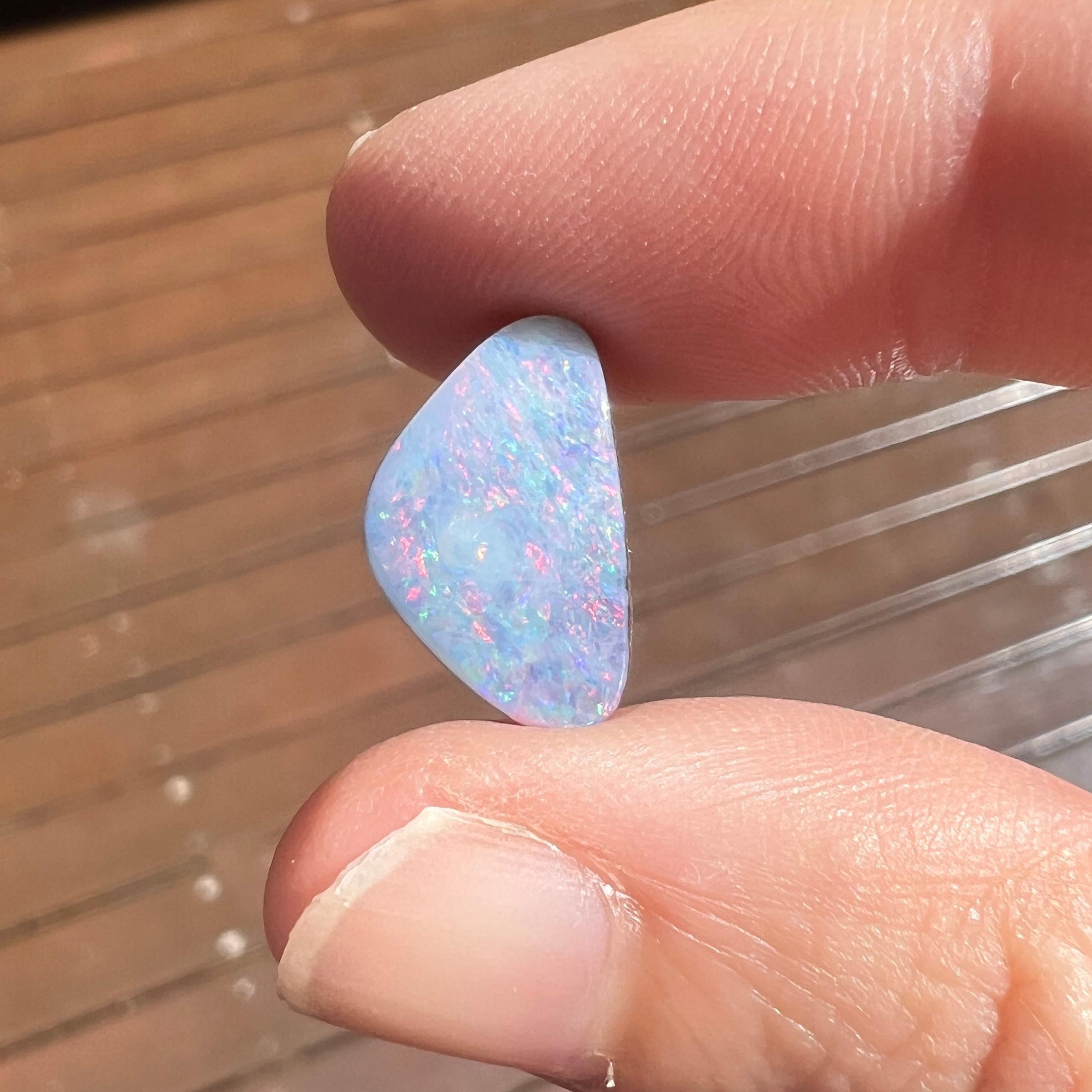 This lovely 5.24 Ct Australian boulder opal was mined by Sue Cooper at her Yaraka opal mine in western Queensland, Australia in 2021. Sue processed the rough opal herself and cut into into a free-form shape. We love the pink colours and its lighter