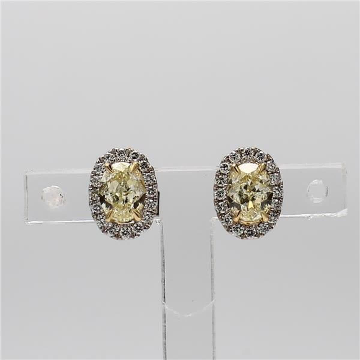 .53cts rare oval natural yellow and white diamond earrings. These earrings are designed to be placed in a simple setting with yellow ovals surrounded by white rounds in a beautiful single halo. Can be used as drop earrings or in addition to your
