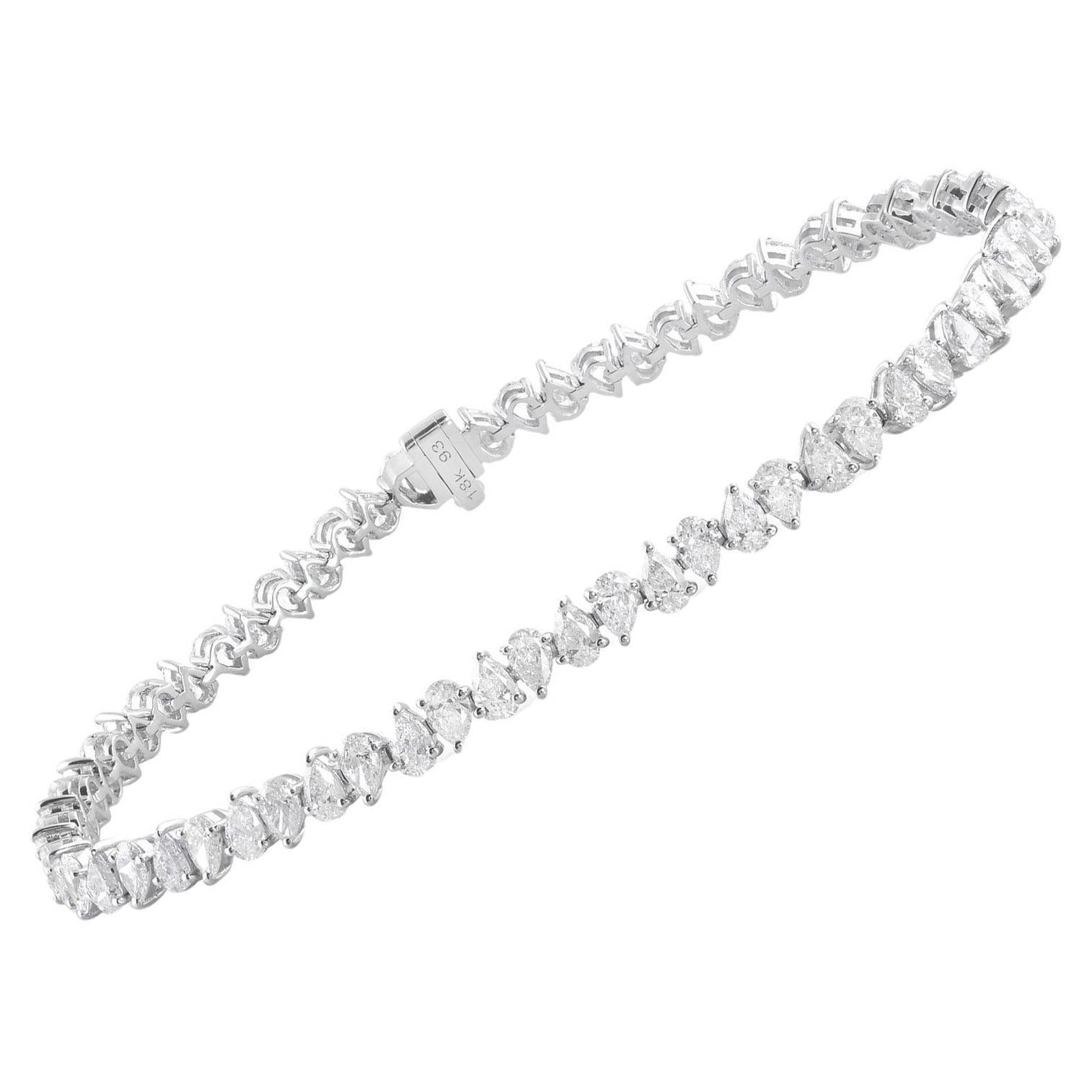 Indulge in the epitome of elegance and luxury with our exquisite Natural 5.30 Carat Pear Shape Diamond Bracelet, crafted meticulously in 14 Karat White Gold. This stunning piece of fine jewelry is a testament to sophistication and refined taste,