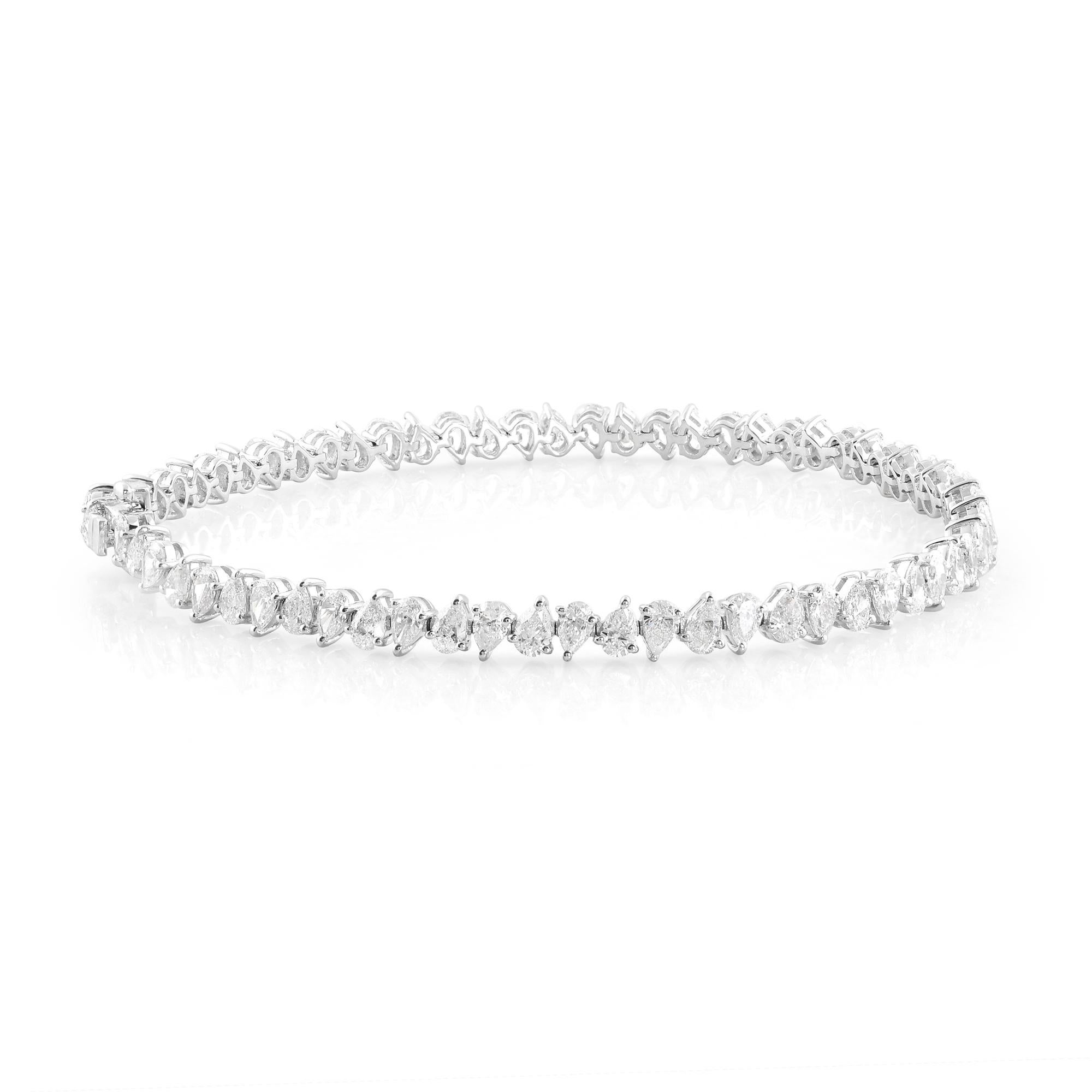 Indulge in the epitome of elegance and luxury with our exquisite Natural 5.30 Carat Pear Shape Diamond Bracelet, crafted meticulously in 14 Karat White Gold. This stunning piece of fine jewelry is a testament to sophistication and refined taste,