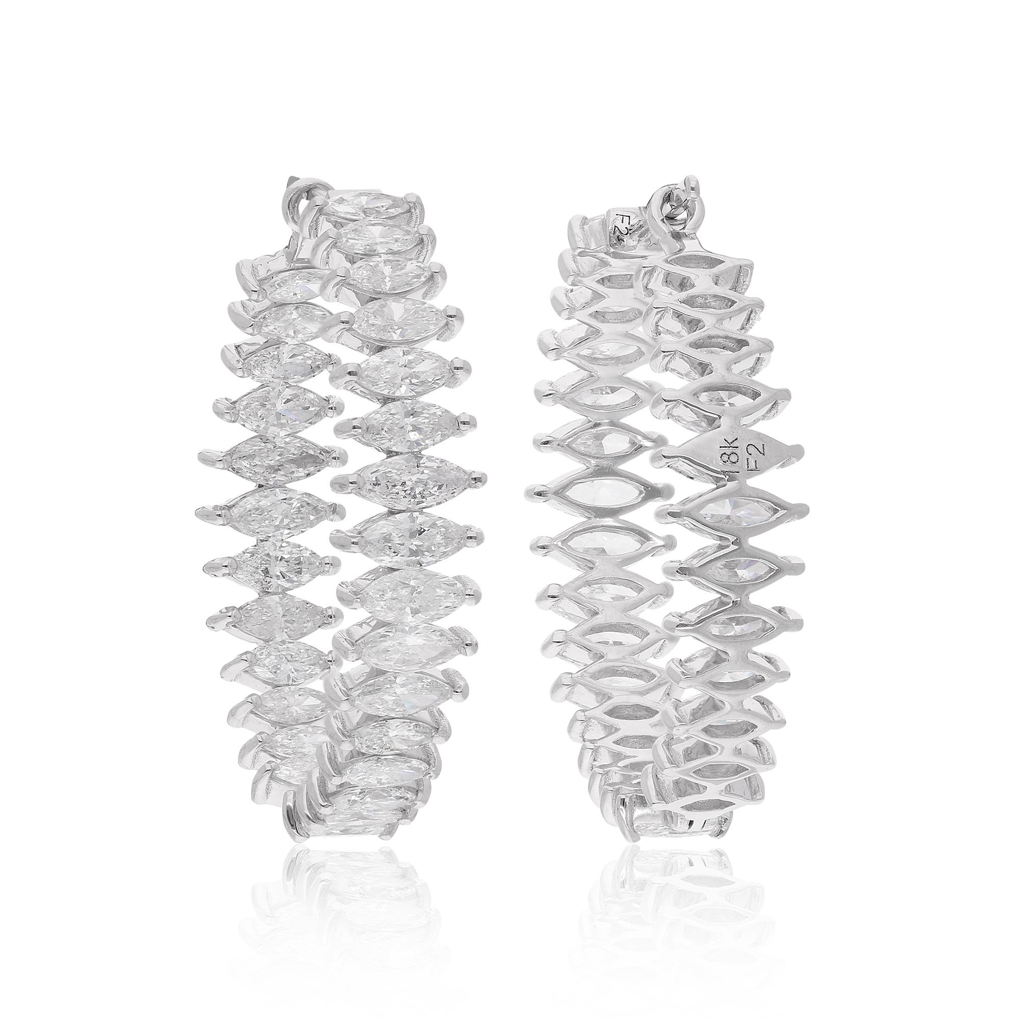 Laissez-vous séduire par l'expression ultime du luxe et de la sophistication avec ces boucles d'oreilles en diamant marquise naturel de 5,47 carats, façonnées à la perfection en or blanc 18 carats. Ces boucles d'oreilles sont un témoignage