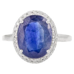 Anillo de zafiro azul ovalado natural de 5,47 quilates y diamantes en blanco macizo de 14k
