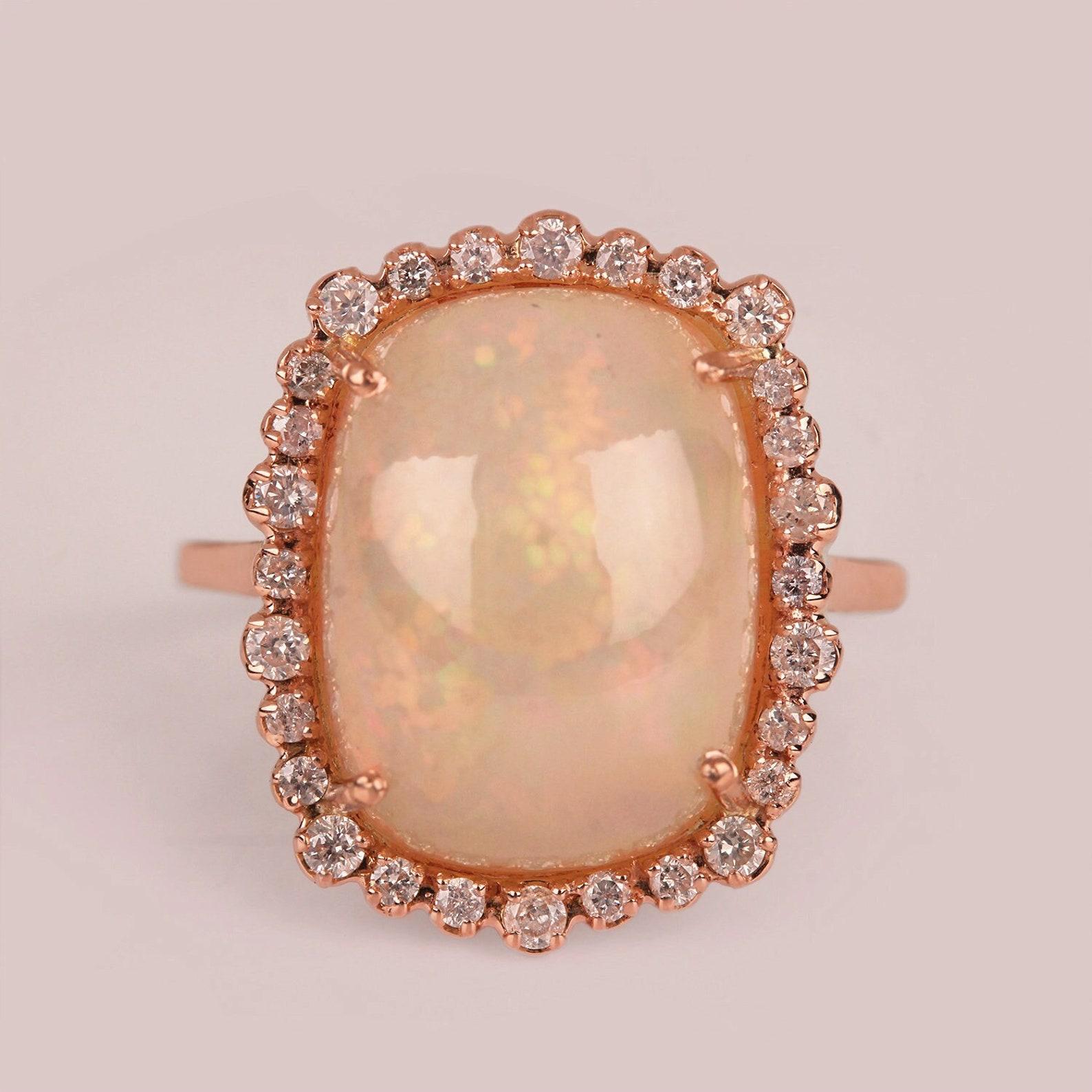 Natural 5.55 Ct Ethiopian Opal Gemstone Cocktail Ring 14k Gold Ring For Women.

Diamond Weight:- 0.34 Ct.
Opal Weight:- 5.55 Ct.
Product Size:- 19 x 15 mm & Ring Size 7 US
Gold Weight:- 2.002 gm


A P P R O X T I M E

All items are custom made to