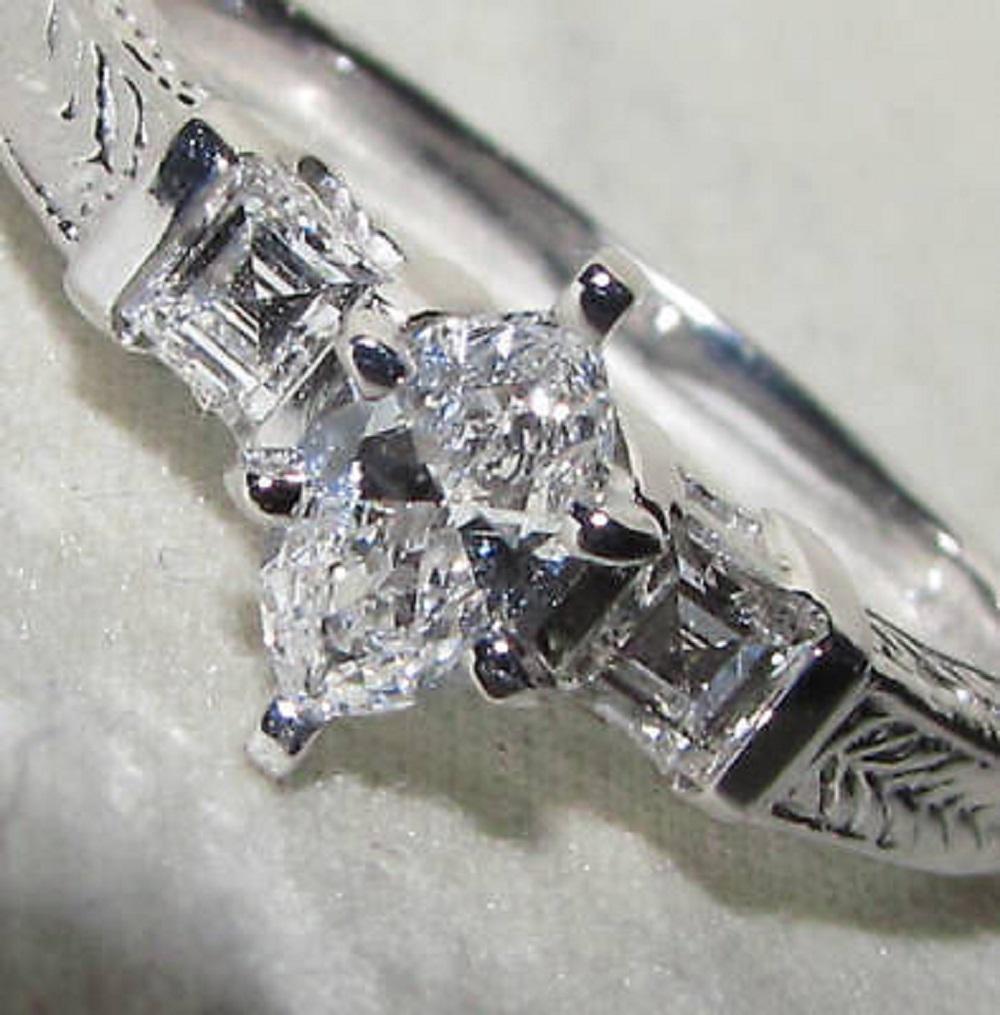 .31ct. Earth-mined Natural Marquise brilliant diamond engagement ring

E-color Vs-1 clarity & excellent brilliant cut

Side ascher cut natural diamonds:

.25ct. Vs-1 clarity, E-color.

4.2 grams

14kt. white gold

$3750 Appraisal