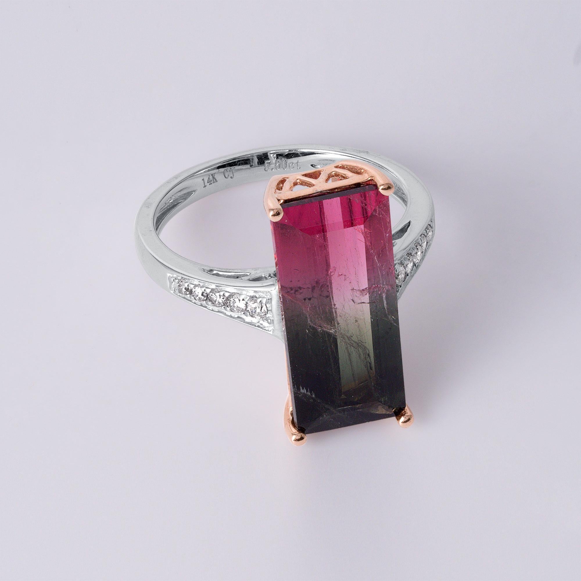 This ring showcases a natural 5.60-carat watermelon tourmaline, a vibrant gemstone with a unique gradient resembling a slice of watermelon.
Prong-set in 14K rose gold, the tourmaline is complemented by diamond accents along a sleek white gold