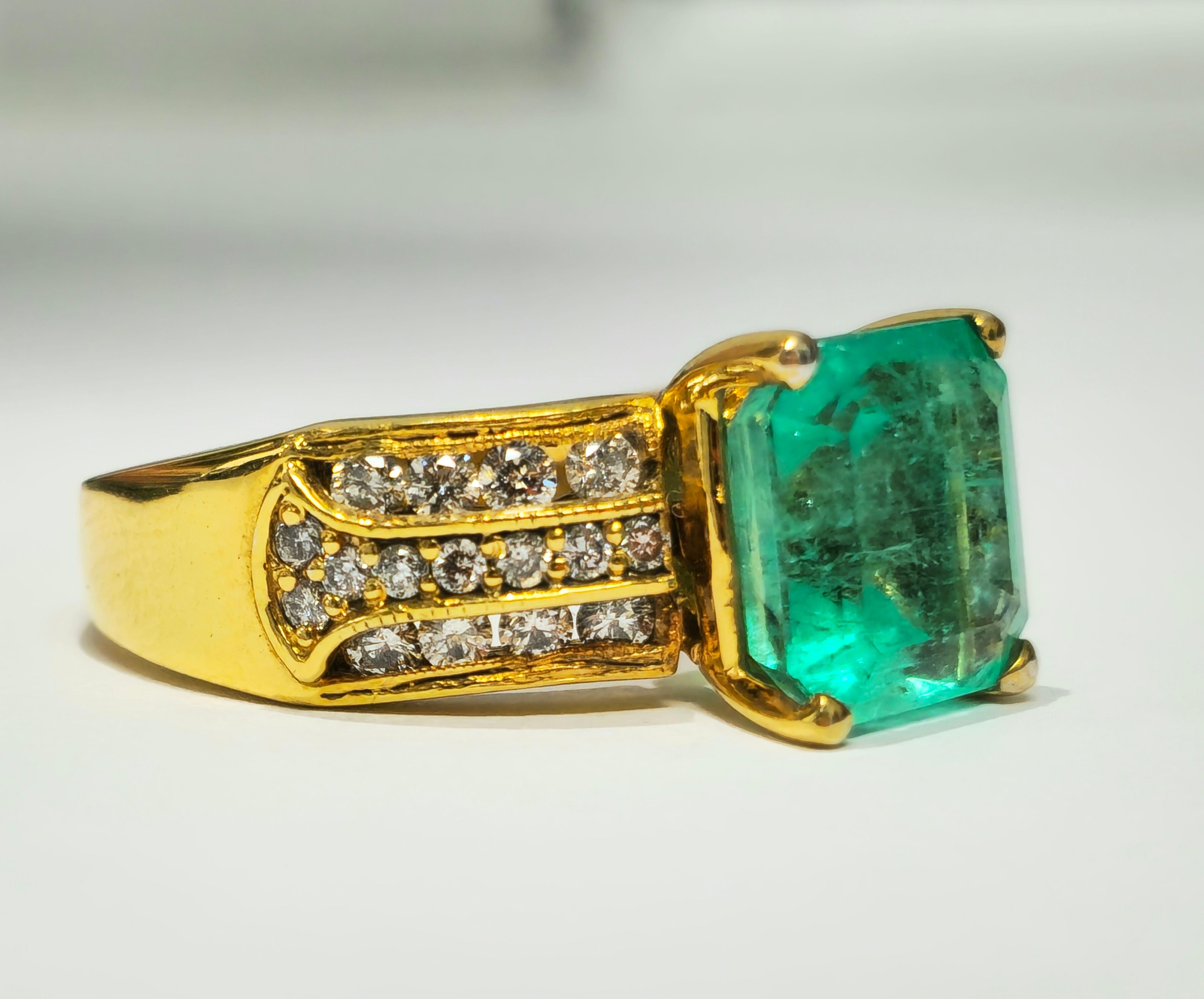 Embrace elegance with our stunning Emerald and Diamond Ring, crafted from radiant yellow gold. Featuring a breathtaking Colombian emerald with a gorgeous hue and intense green color, this ring exudes natural beauty and sophistication. Adorned with
