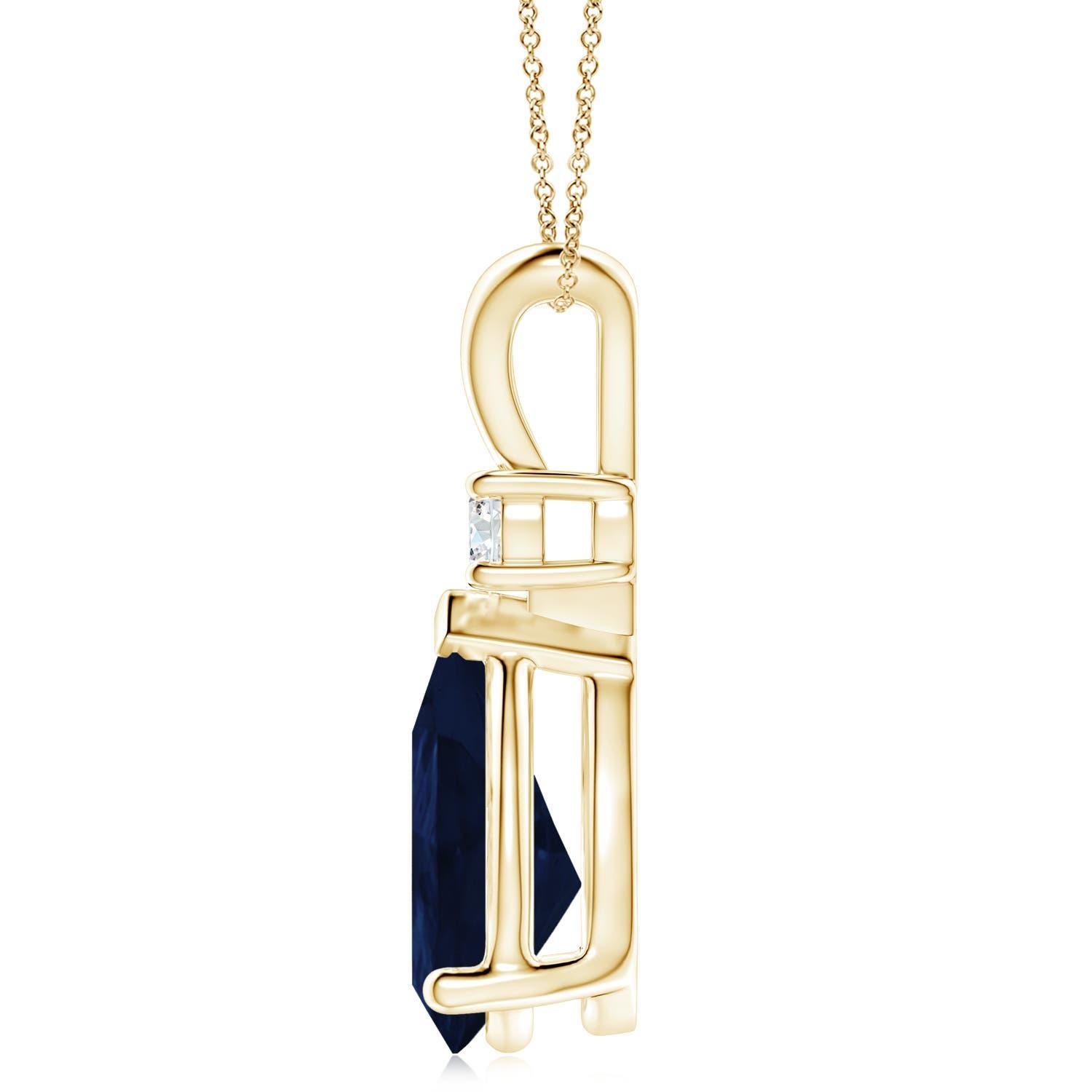 This classic solitaire pendant features a pear-shaped sapphire secured in a prong setting. A brilliant round diamond sits atop the blue gemstone adding to the design's charm. Simple yet appealing, this sapphire pendant in 18k yellow gold is crafted