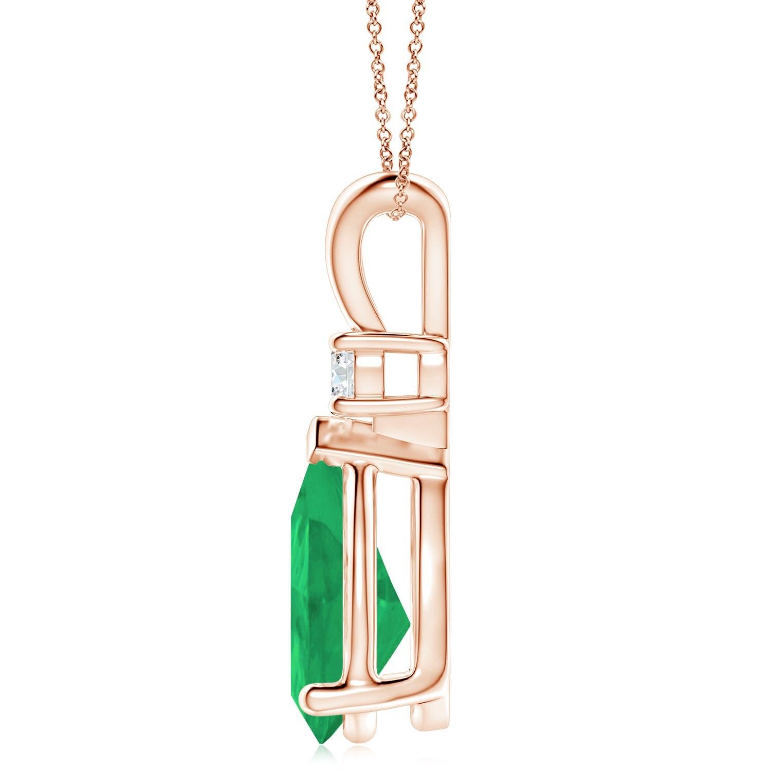 This classic solitaire pendant features a pear-shaped emerald, secured in a prong setting. A brilliant round diamond sits atop the lush green gemstone adding to the design's beauty. Simple yet alluring, this emerald pendant in 18k rose gold is
