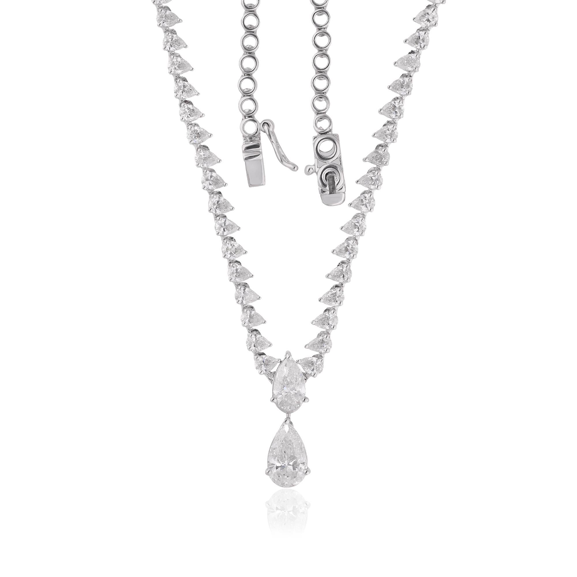 The pear-shaped diamond is delicately suspended from a sleek white gold chain, adding a touch of modernity and refinement to the design. The 14 karat white gold setting provides a luxurious backdrop for the dazzling diamond, enhancing its brilliance