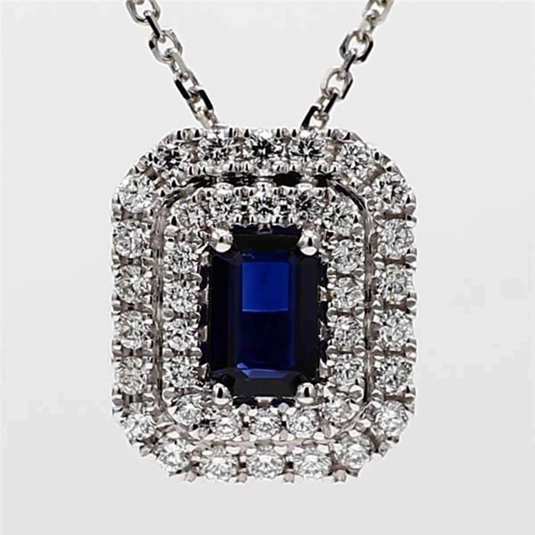 RareGemWorld's classic sapphire pendant. Mounted in a beautiful 18K White Gold setting with a natural emerald cut blue sapphire. The sapphire is surrounded by natural round white diamond melee. This pendant is guaranteed to impress and enhance your