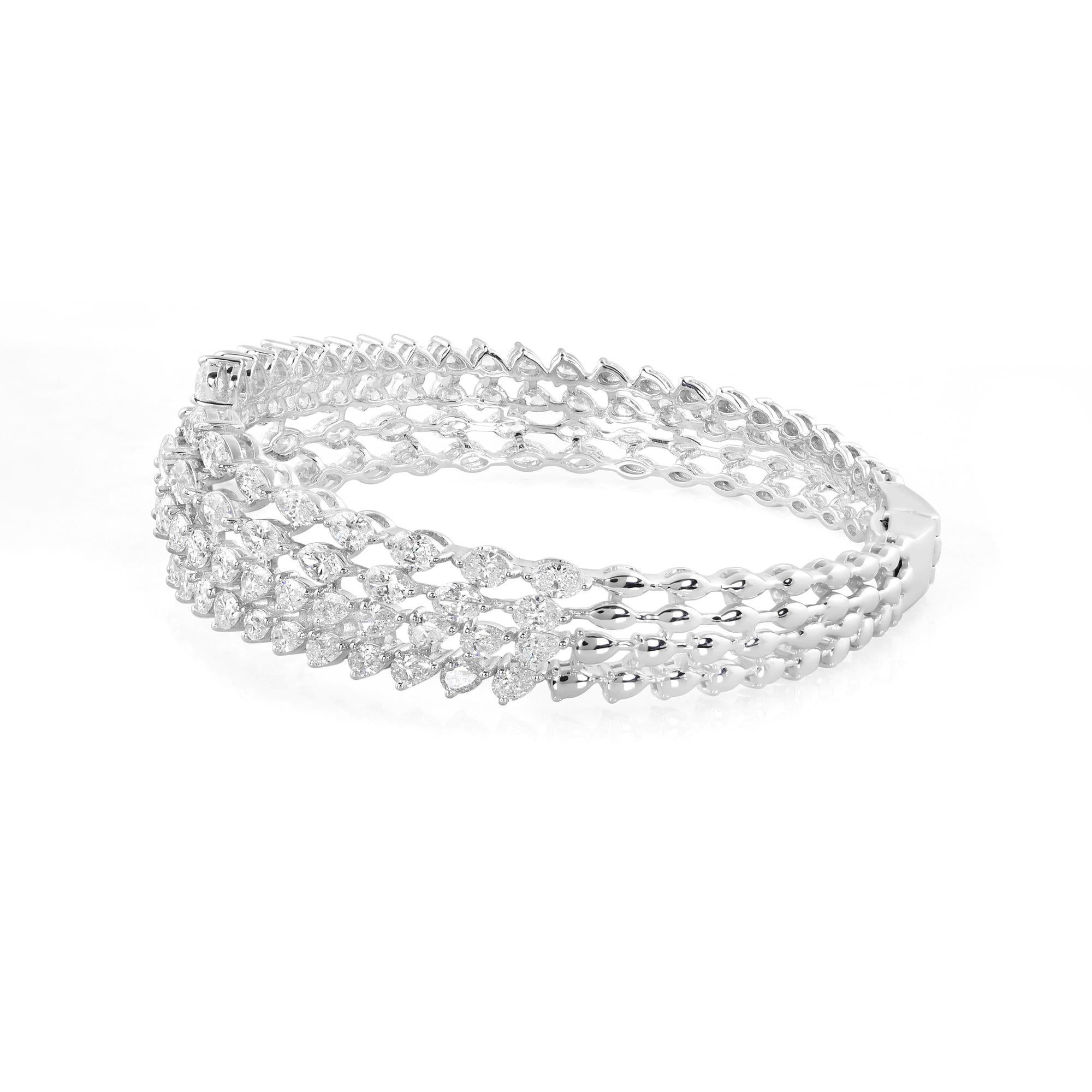 Adorn your wrist with the epitome of opulence and sophistication with this breathtaking Natural 7.1 Carat Pear Marquise Diamond Cuff Bangle Bracelet, meticulously crafted in lavish 18 karat white gold. This exquisite piece of jewelry embodies