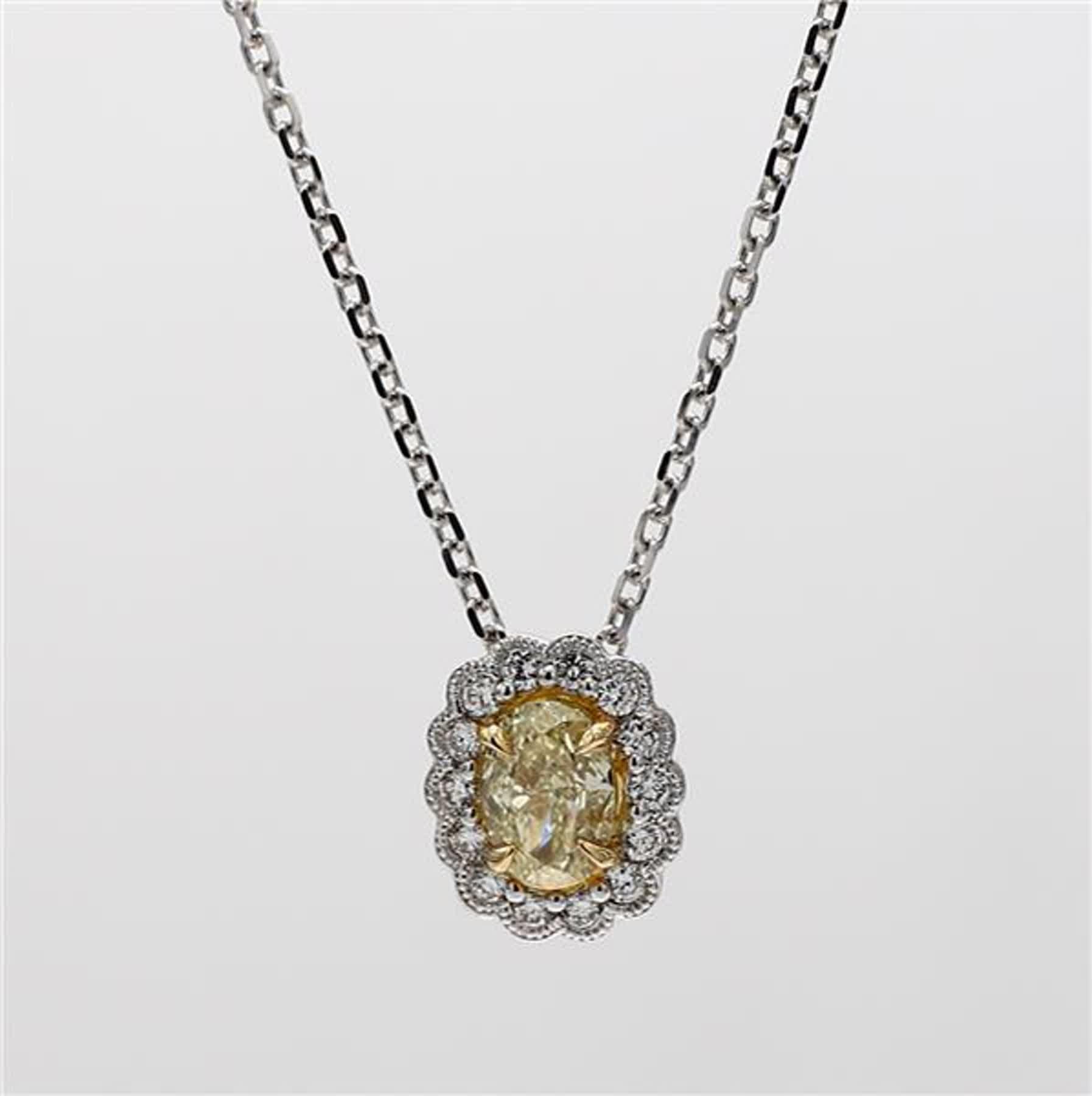 RareGemWorld's classic diamond pendant. Mounted in a beautiful 18K Yellow and White Gold setting with a natural oval cut yellow diamond. The yellow diamond is surrounded by natural round white diamond melee. This pendant is guaranteed to impress and