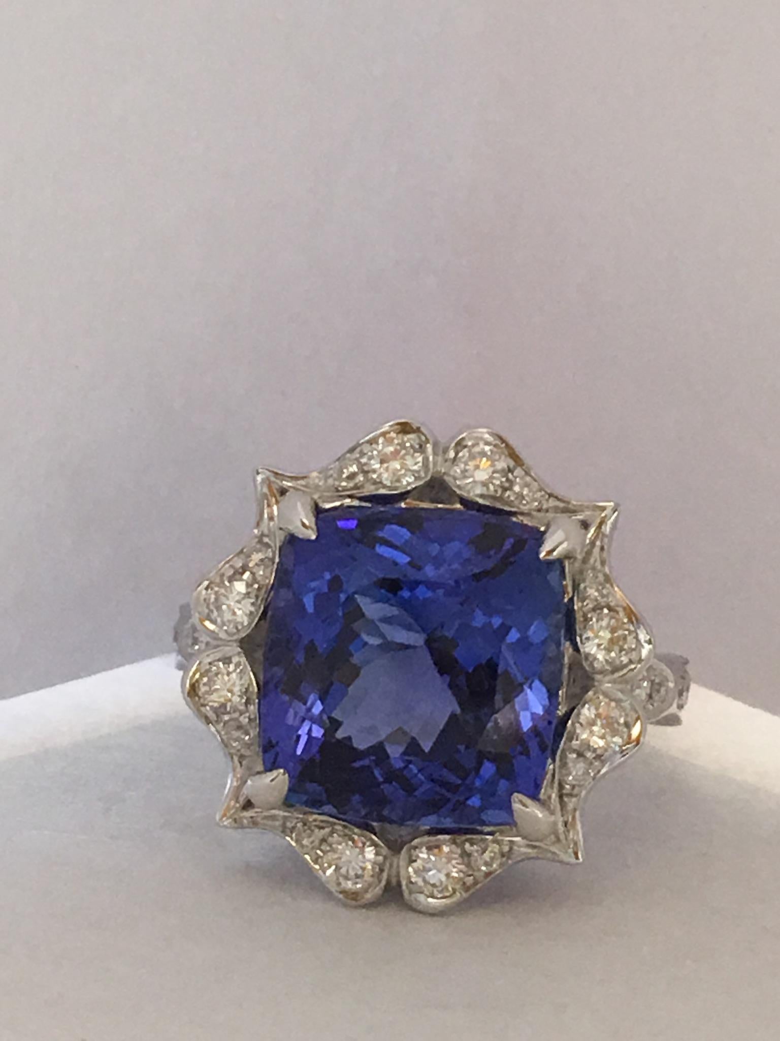 Natural Tanzanite weigh 7.53 Carat and 0.42 Carat diamonds set in 14K white gold is handmade ring.This is AA Quality Tanzanite. The photo is not enhanced or with out photo shop.
