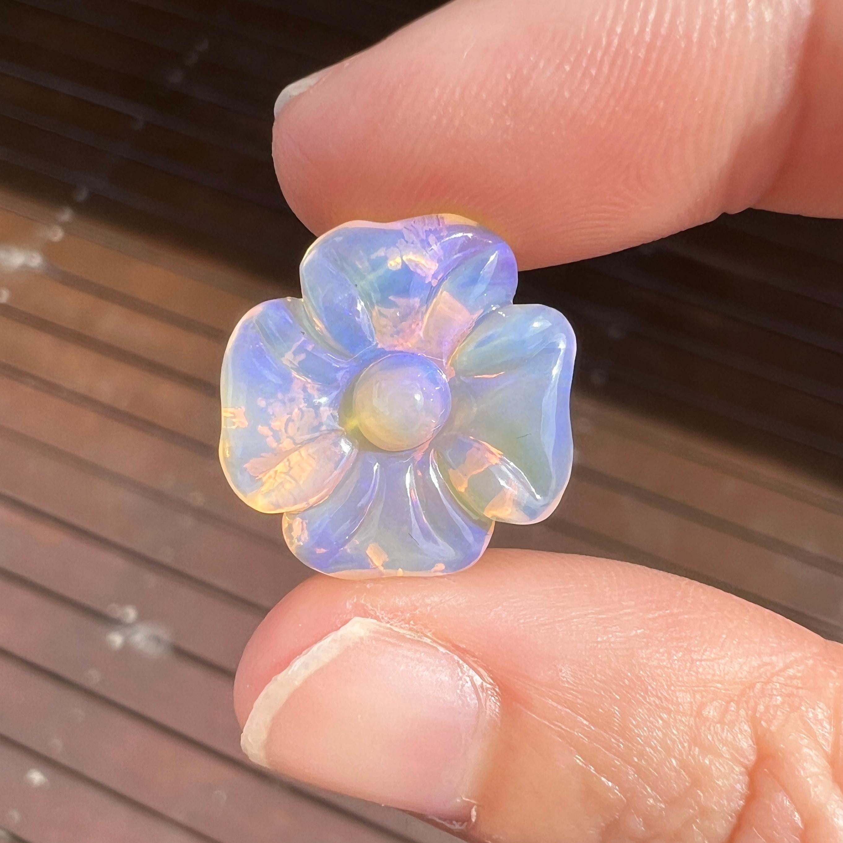 This beautiful 7.61 Ct Australian wood replacement opal was mined by Sue Cooper at her Russells opal mine in western Queensland, Australia in 2021. Sue processed the rough opal herself and selected it to be carved into a flower. The opal's size of