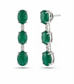 Natural 7.65CTS Emerald & 0.10CTS Diamond Earring in 18K Gold