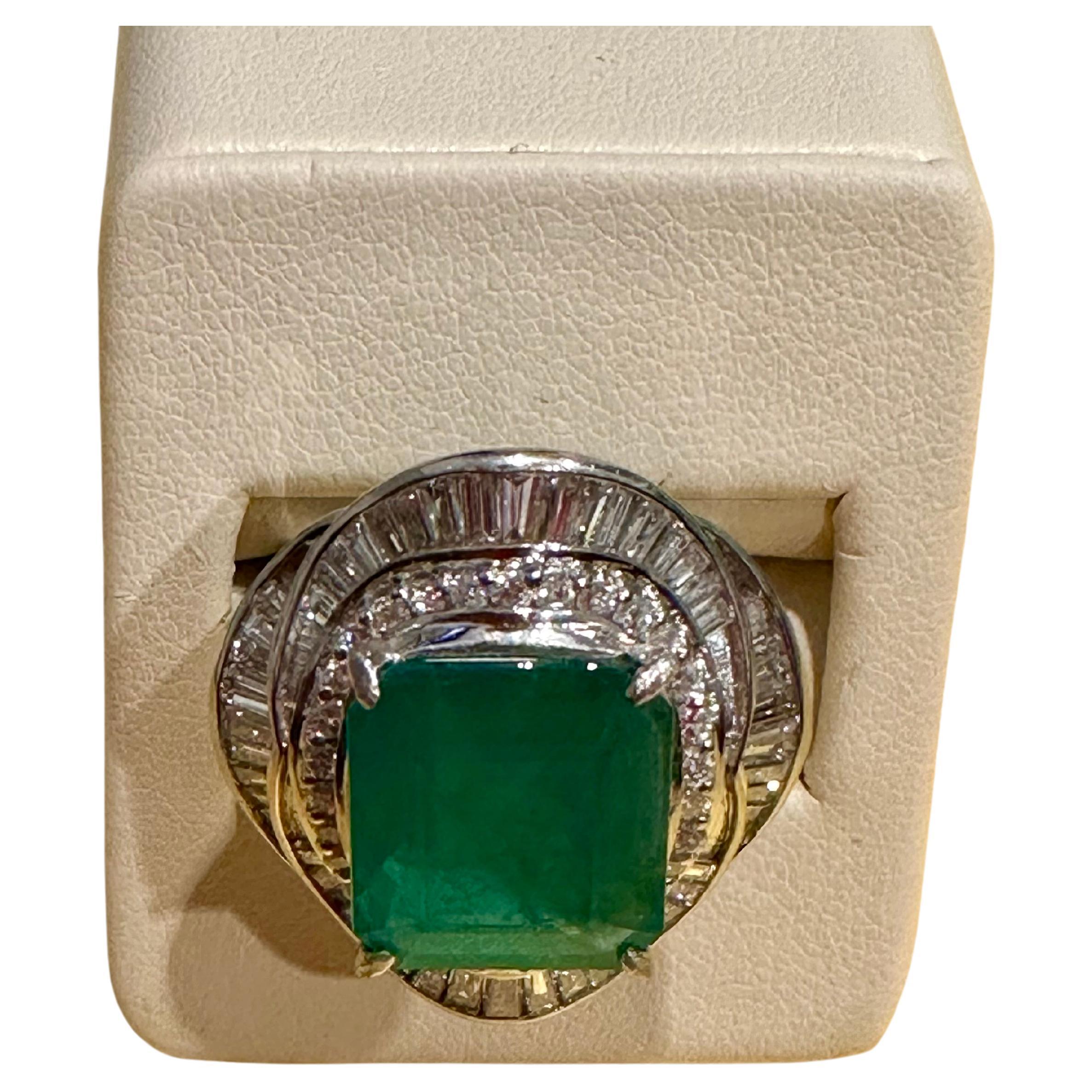 Natural 8 Carat Emerald Cut Zambian Emerald & Diamond Ring in Platinum, Estate
A classic design  ring , Ring Size 6
Approximately 8 Carat  Emerald Cut Emerald Absolutely gorgeous emerald , Very desirable color .
Origin Zambia
 Platinum  20 gm with