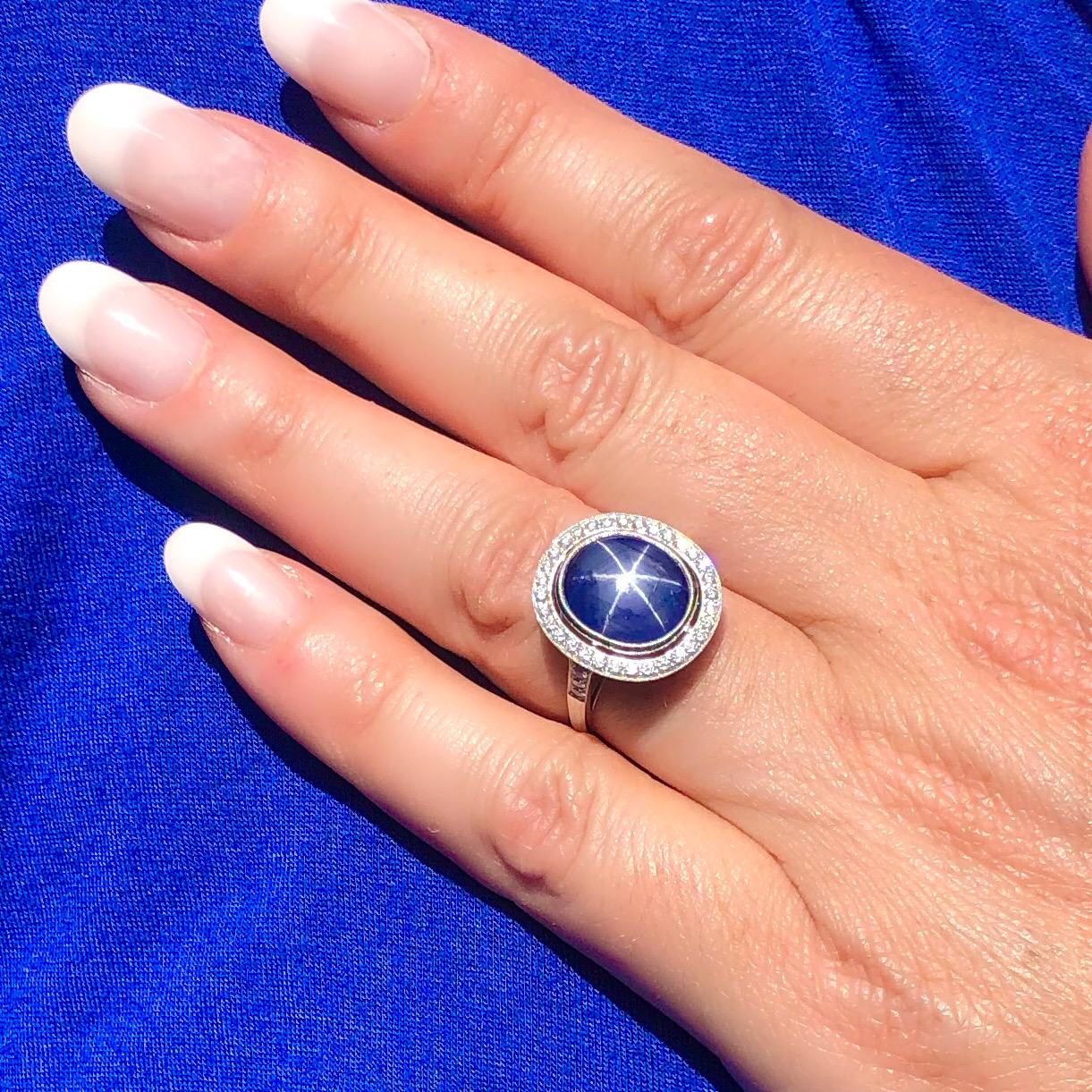 Platinum ring setting features one Oval Cabochon Cut Natural Blue Star Sapphire for a total weight of 8.55cts accented by approximately 0.40cts of Round Brilliant Cut Diamonds.  The total weight of the ring is 7.2 grams.  Star Sapphire has not been