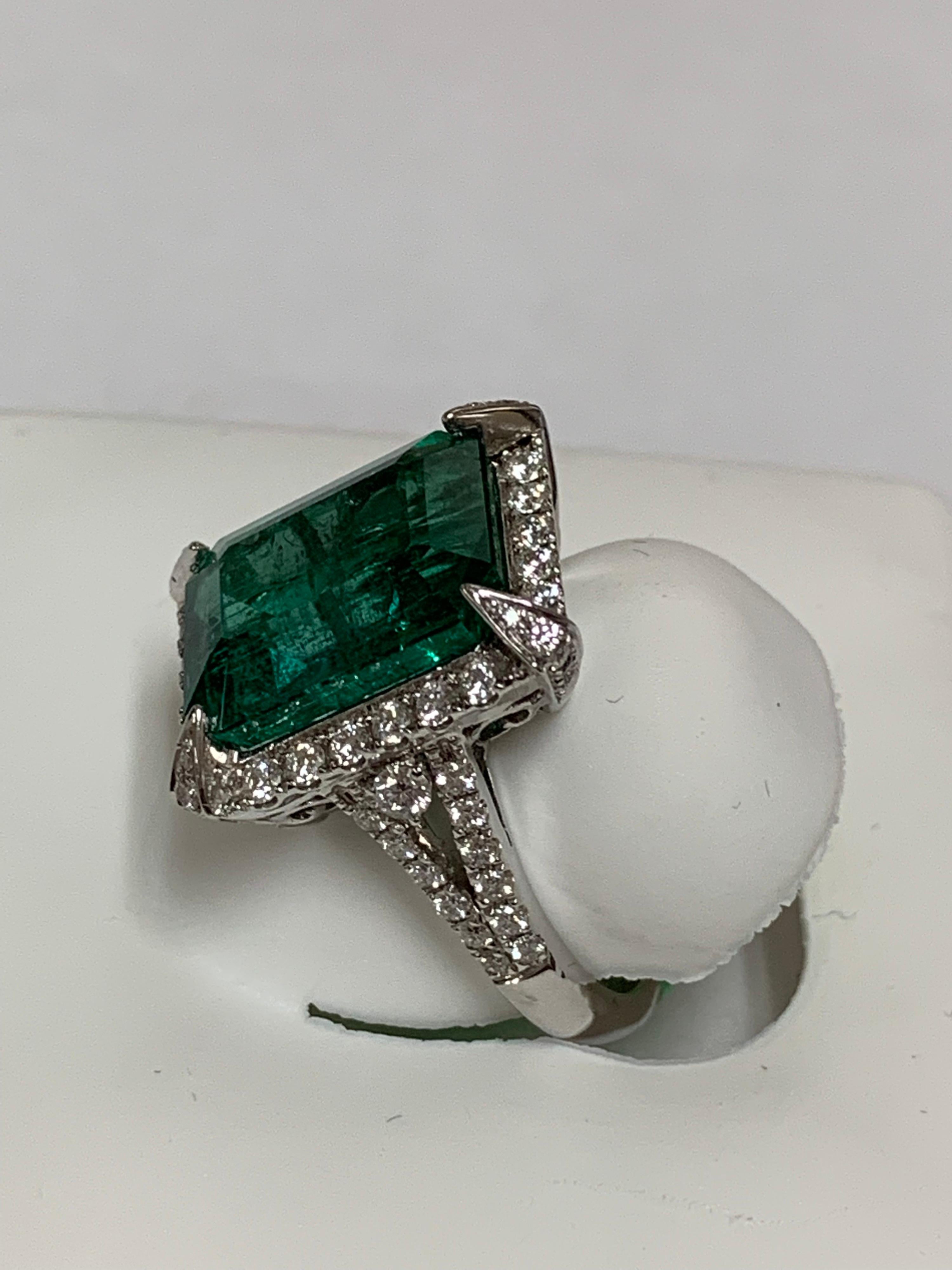 Natural emerald cut emerald 8.63 Carat and white round diamonds 1 carat set in 18 karat white gold is one of a kind handcrafted ring. The ring is size 7 and can be resized if needed.