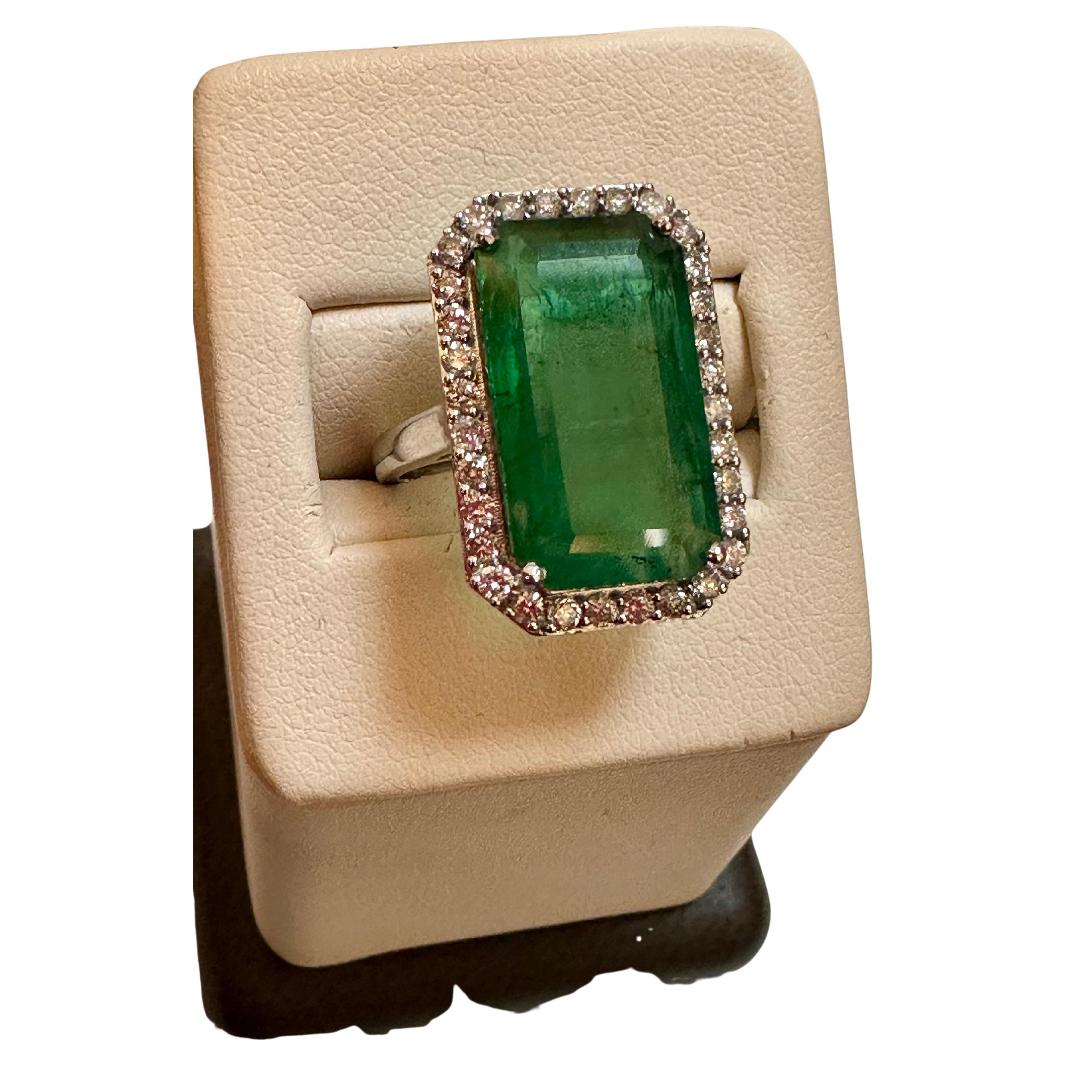 Natural 9 Carat Emerald Cut Zambian Emerald & Diamond Ring in 14Kt  White Gold
A classic design  ring , Ring Size 6.75
Exact 9 Carat  Emerald Cut Emerald Absolutely gorgeous emerald , Very desirable color .
Origin Zambia
14 Karat white gold   6.6 gm